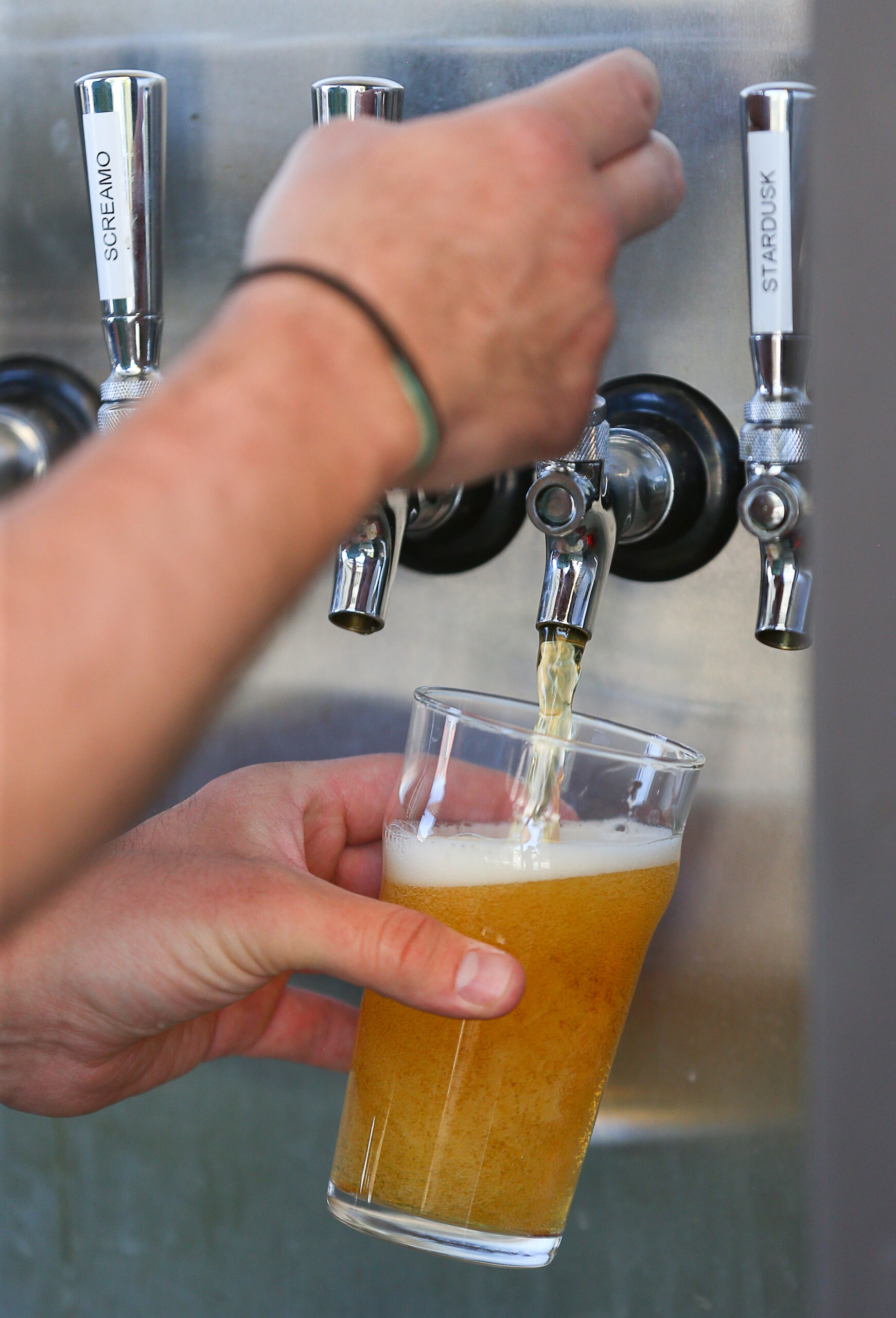 Eric Grimes pours a glass of Atlas Blonde Ale at Fogbelt Brewing Companys Fogbelt Station in Healdsburg on Friday, August 12, 2022. (Christopher Chung/The Press Democrat)