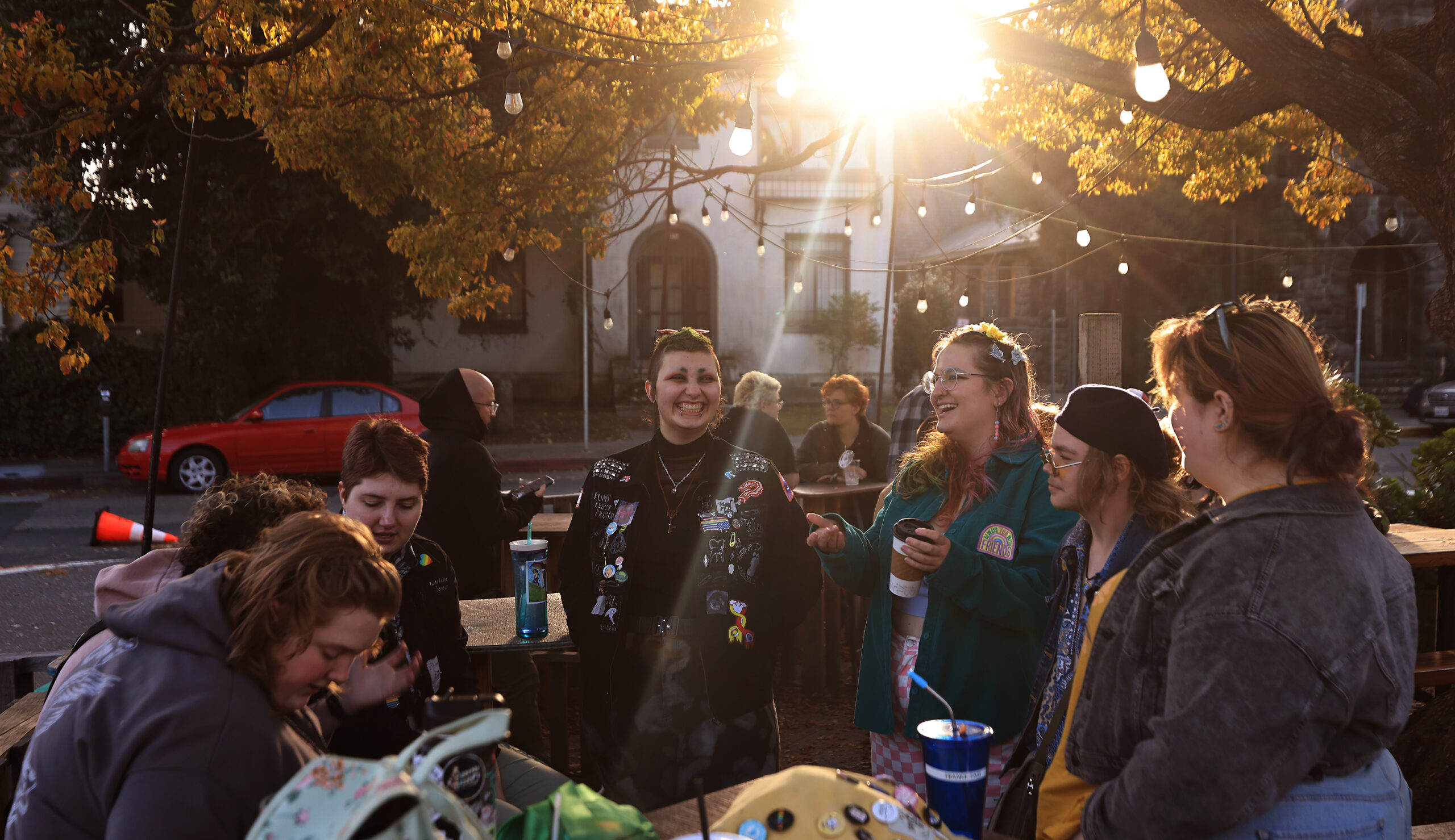 At Brew Coffee and Beer House in Santa Rosa, people gather for Transgender Day of Visibility, Friday, March 31, 2023, including Eloria Smith, who identifies as nonbinary, third from right, and transgender man Teddy Fast (he/him), second right. (Kent Porter / The Press Democrat) 