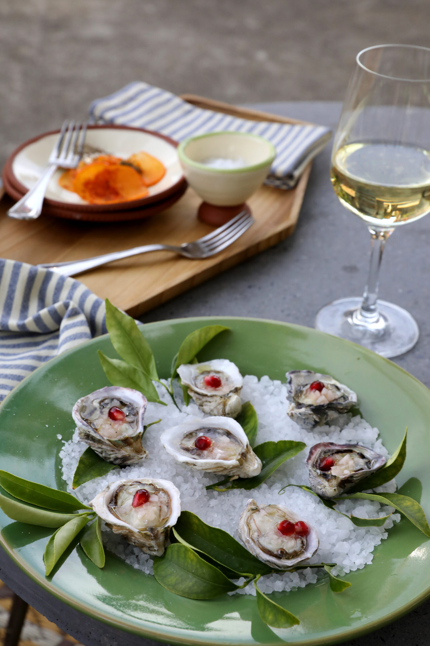 Oysters with pomegranate kernels and Yorkville olive oil and shaved Fuyu persimmons with Penny Royal Laychee goat cheese, topped with pumpkin seeds, Piment d'Ville chili powder, lime zest, and bronze fennel sprigs at the Boonville Hotel in Boonville on Monday, November 11, 2019. (BETH SCHLANKER/ The Press Democrat)