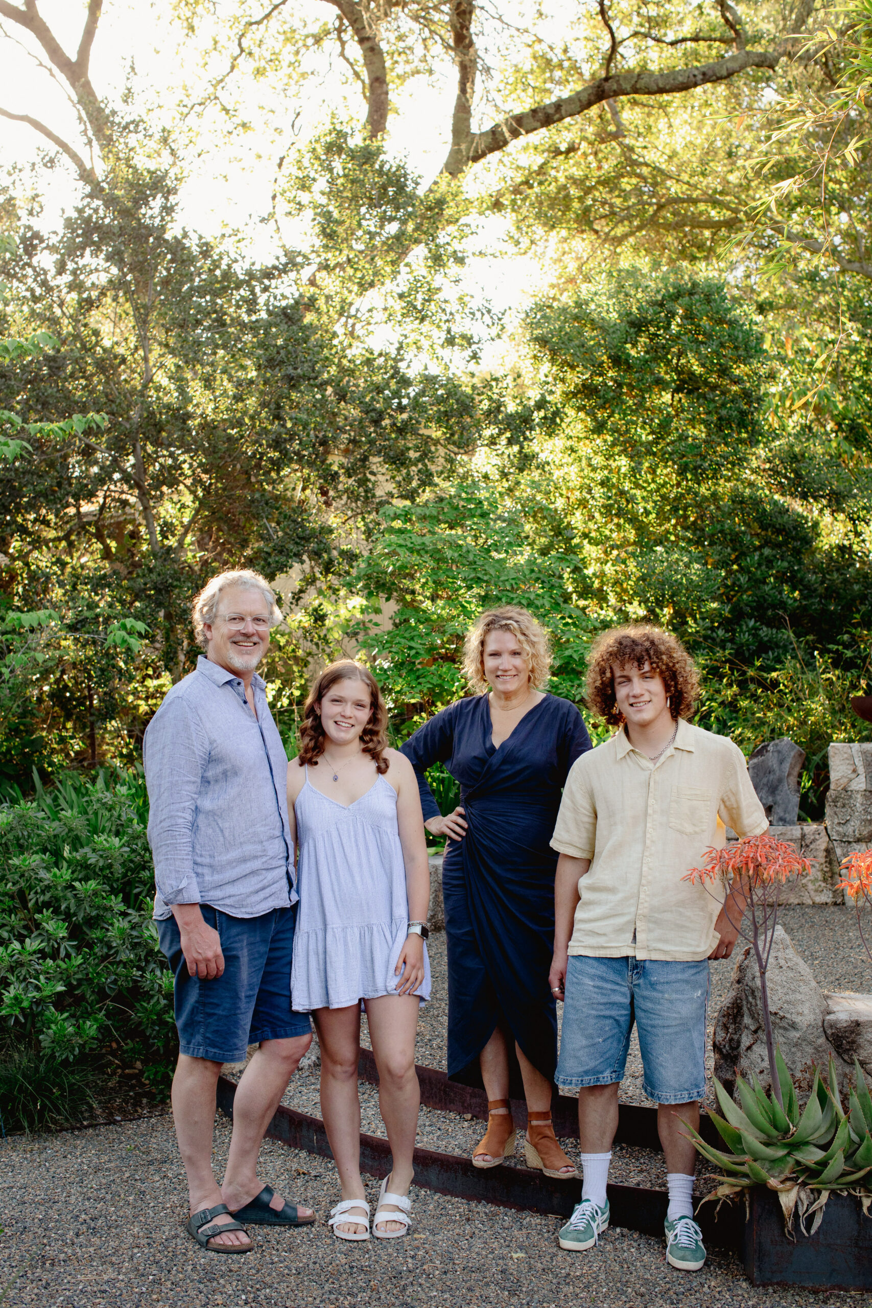 Mike, Flora, Jennifer, and Owen Lucas in their Healdsburg garden. (Eileen Roche)