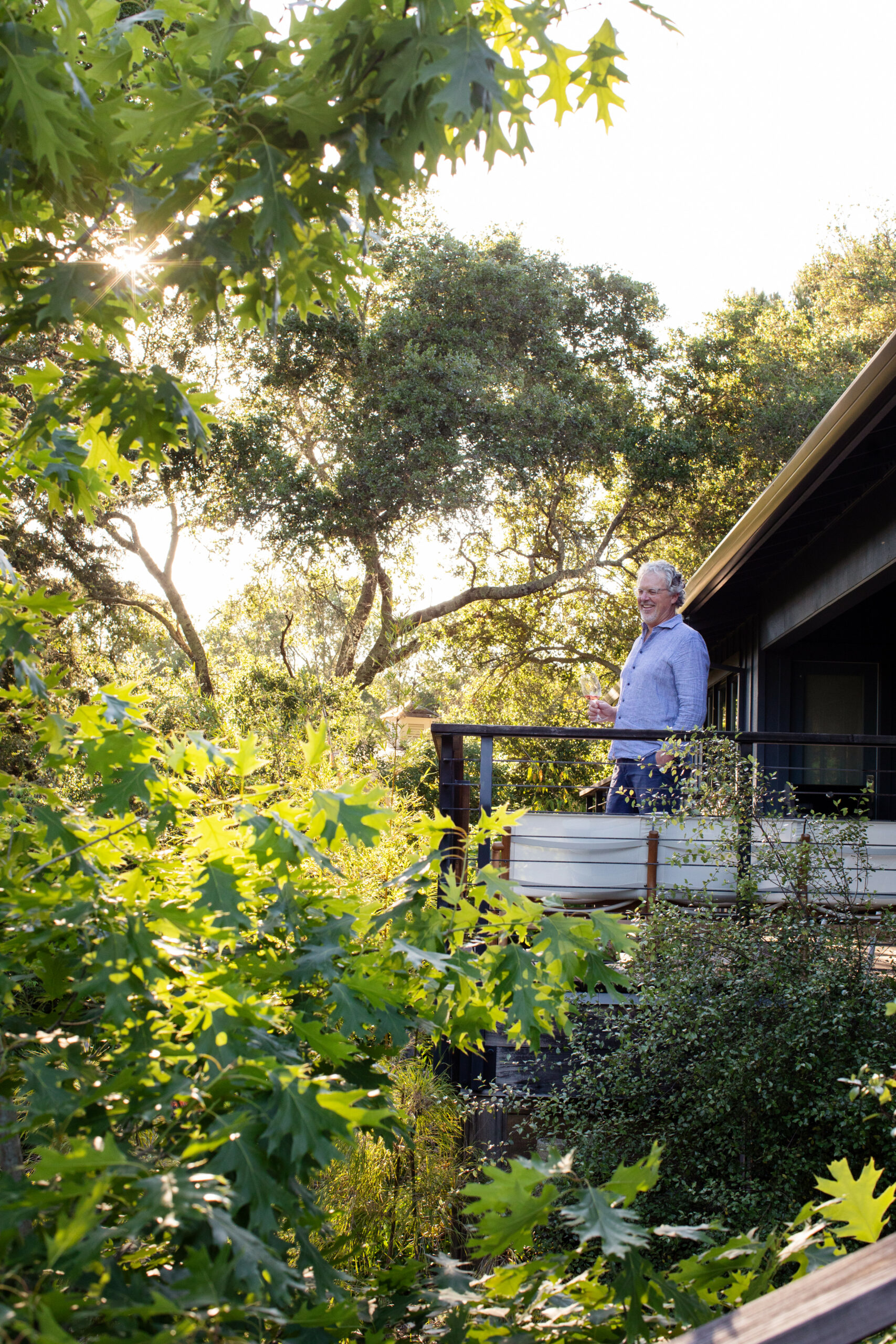 Landscape architect Mike Lucas on the porch overlooking his Healdsburg garden. (Eileen Roche)