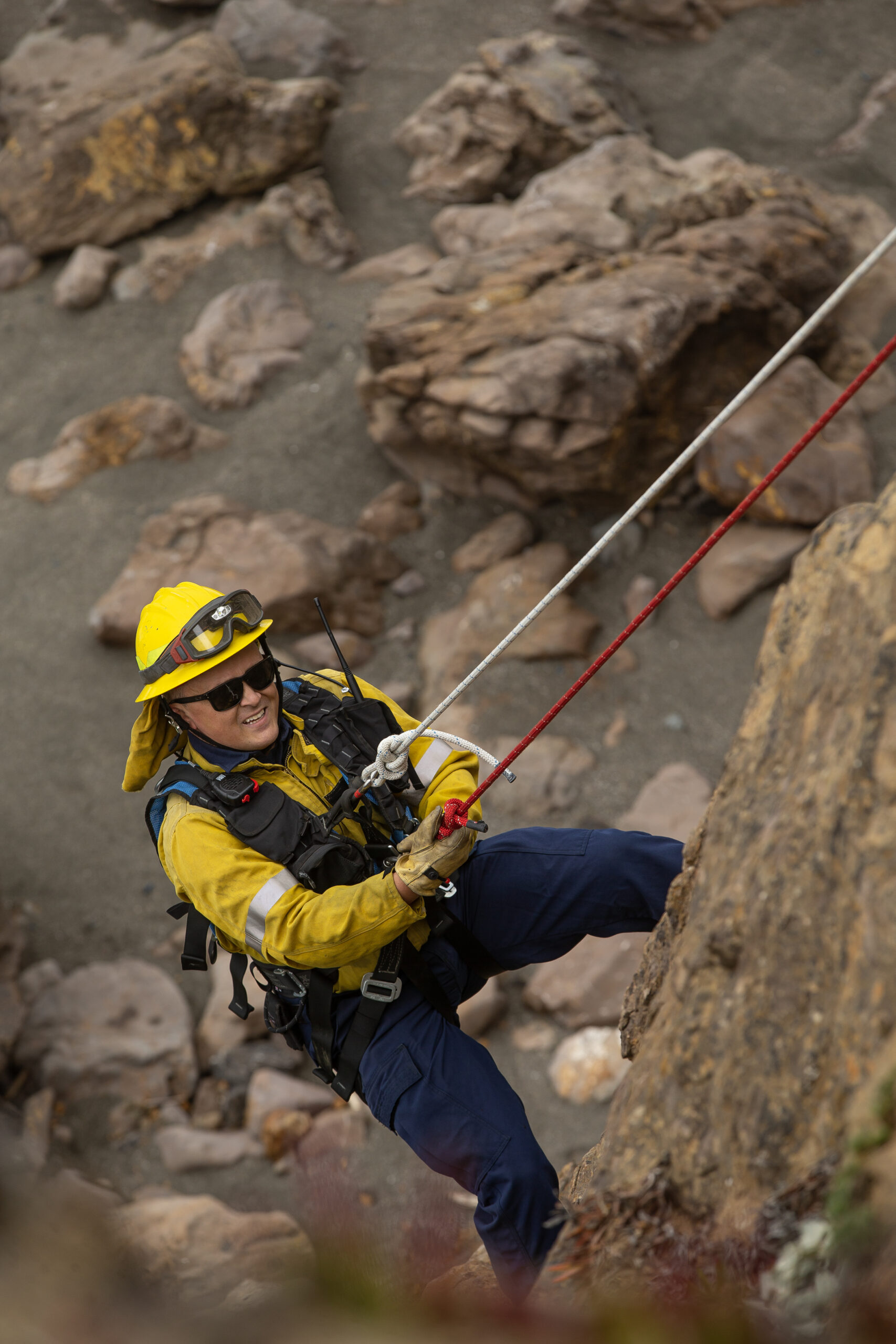 Sonoma County Fire District firefighters from Bodega BayÕs station 10, work on their cliff rescue skills off Coleman Valley Overlook along Hwy 1 during training May 19, 2023. Firefighter Erich Engle makes his way up the cliff to the staging area. (Chad Surmick / The Press Democrat)