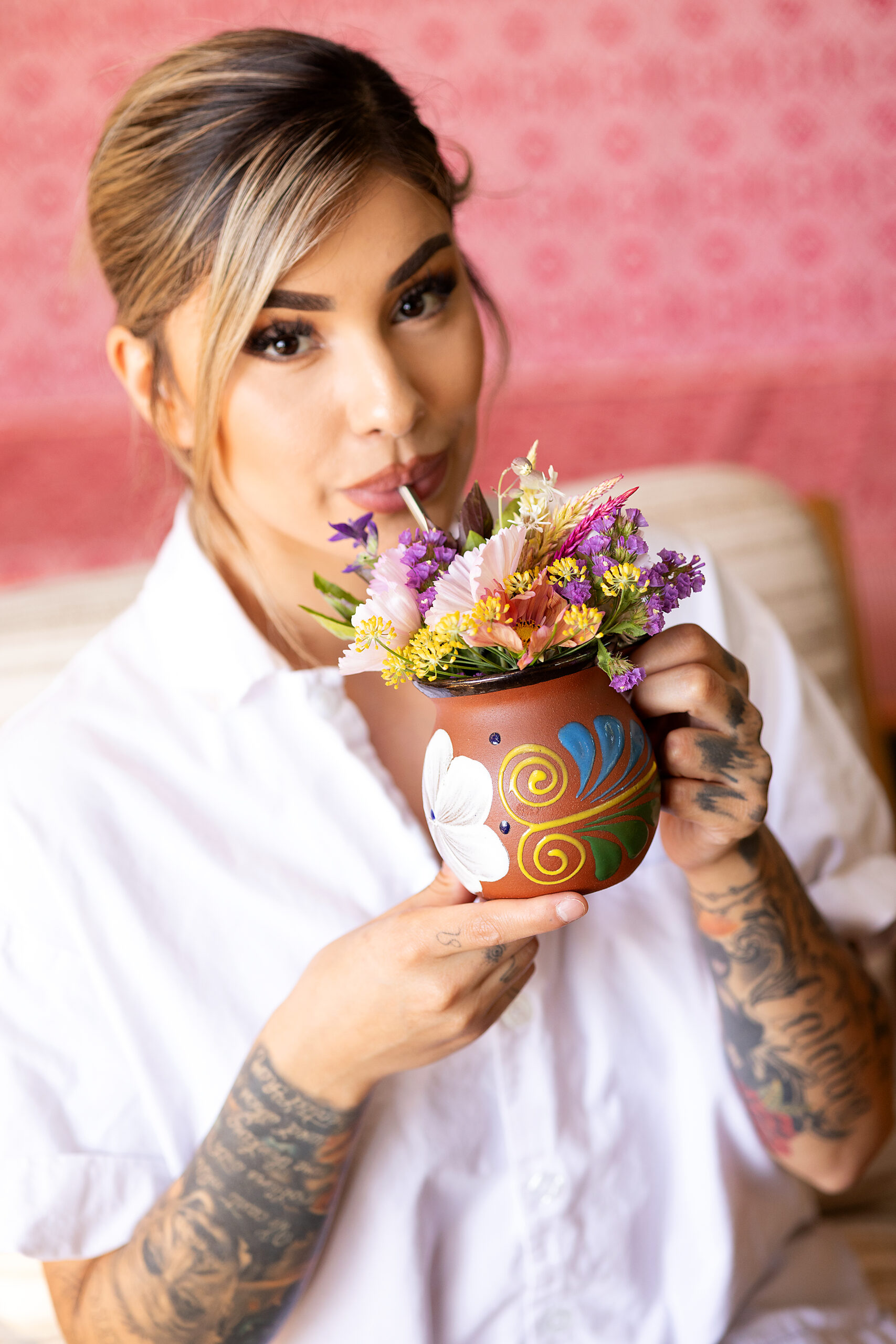 Guests at Second Story are greeted with a drink drawn through a bouquet of flowers with a stainless straw at the new upstairs vegan restaurant at Little Saint in Healdsburg September 8, 2023. (Photo John Burgess/The Press Democrat)