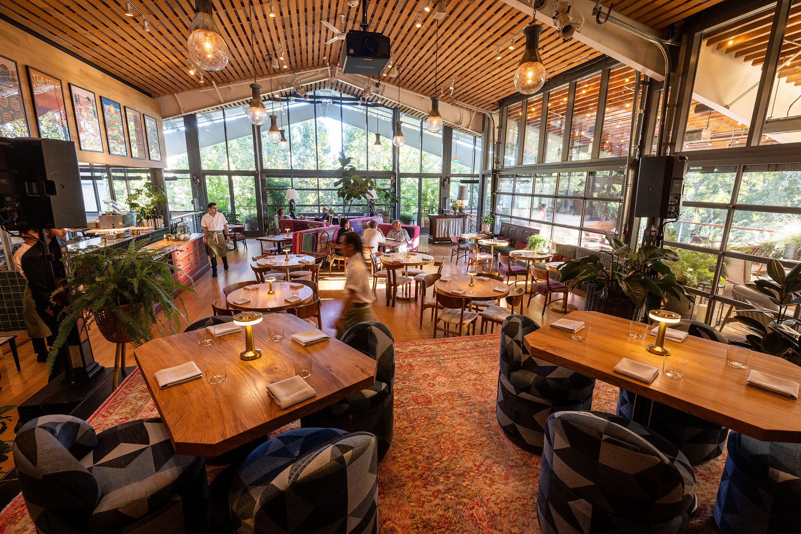 The upstairs music venue, set up with dining tables and bistro chairs, at Little Saint in Healdsburg