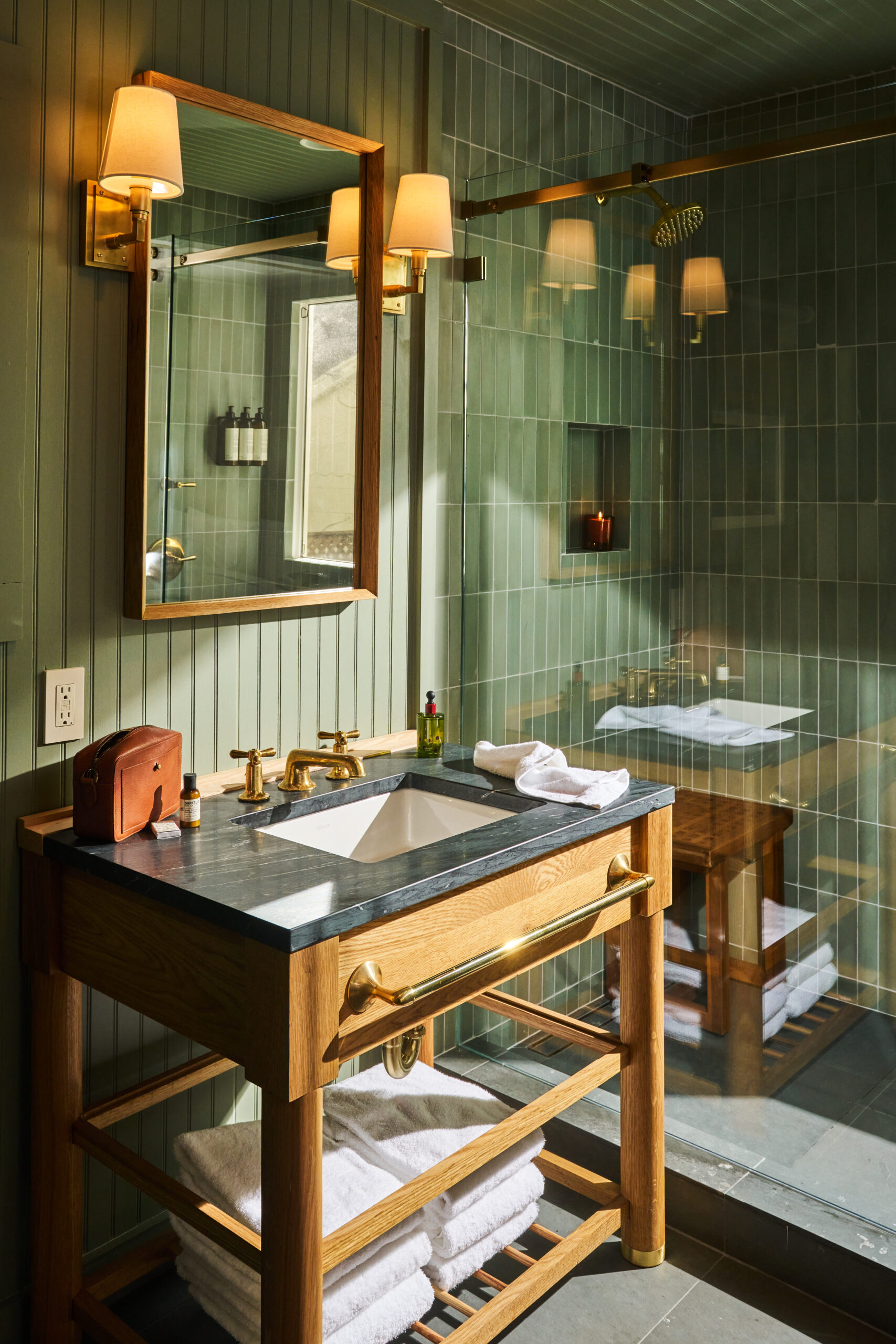 gleaming bathrooms with handmade sage-green tile that echoes the colors of the trees and river. (Gentl and Hyers/Dawn Ranch)