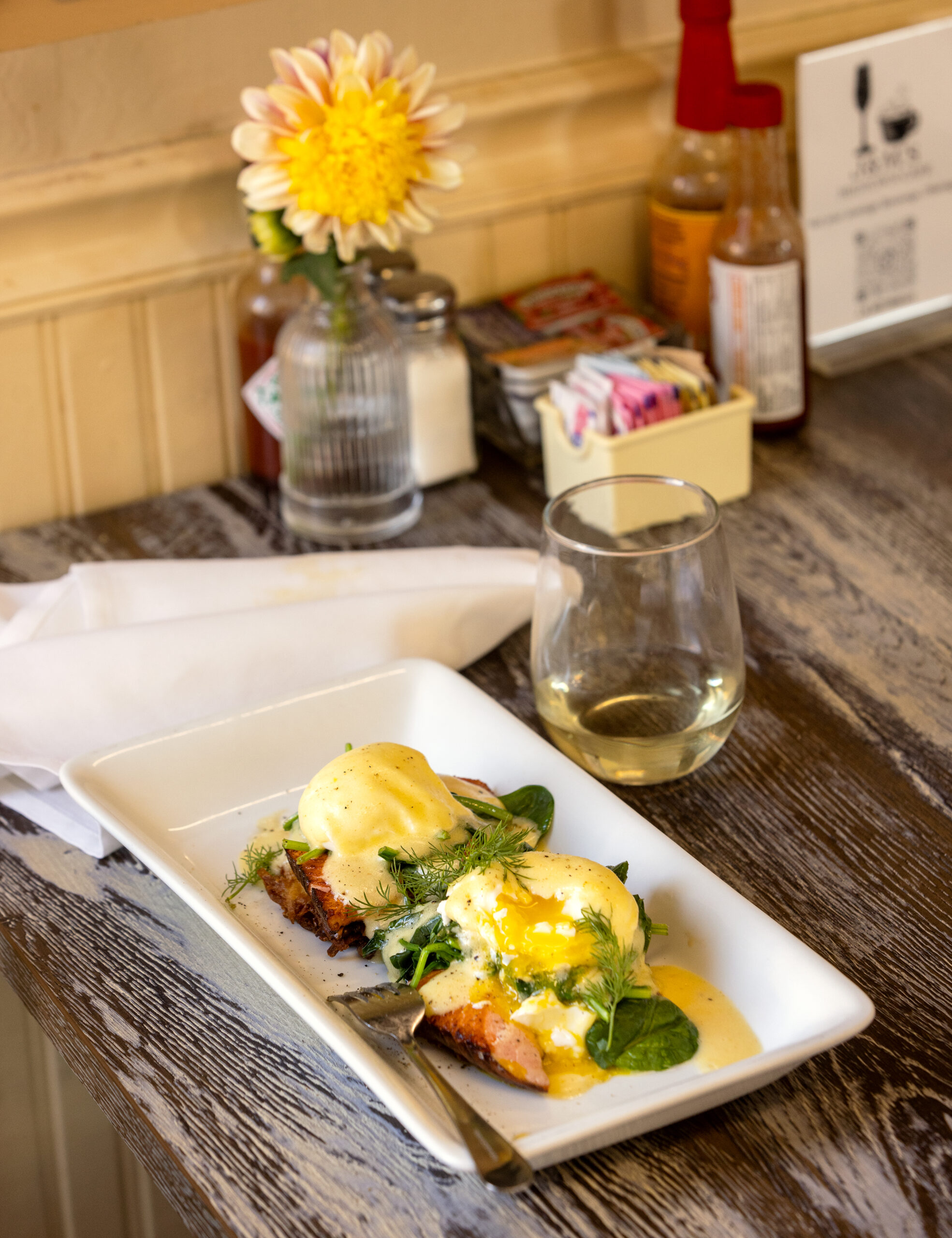 Meiomei Chardonnay with House-Smoked Salmon Latkes Benedict from the new J & M’s Midtown Café October 23, 2023 in Santa Rosa. (Photo John Burgess/The Press Democrat)