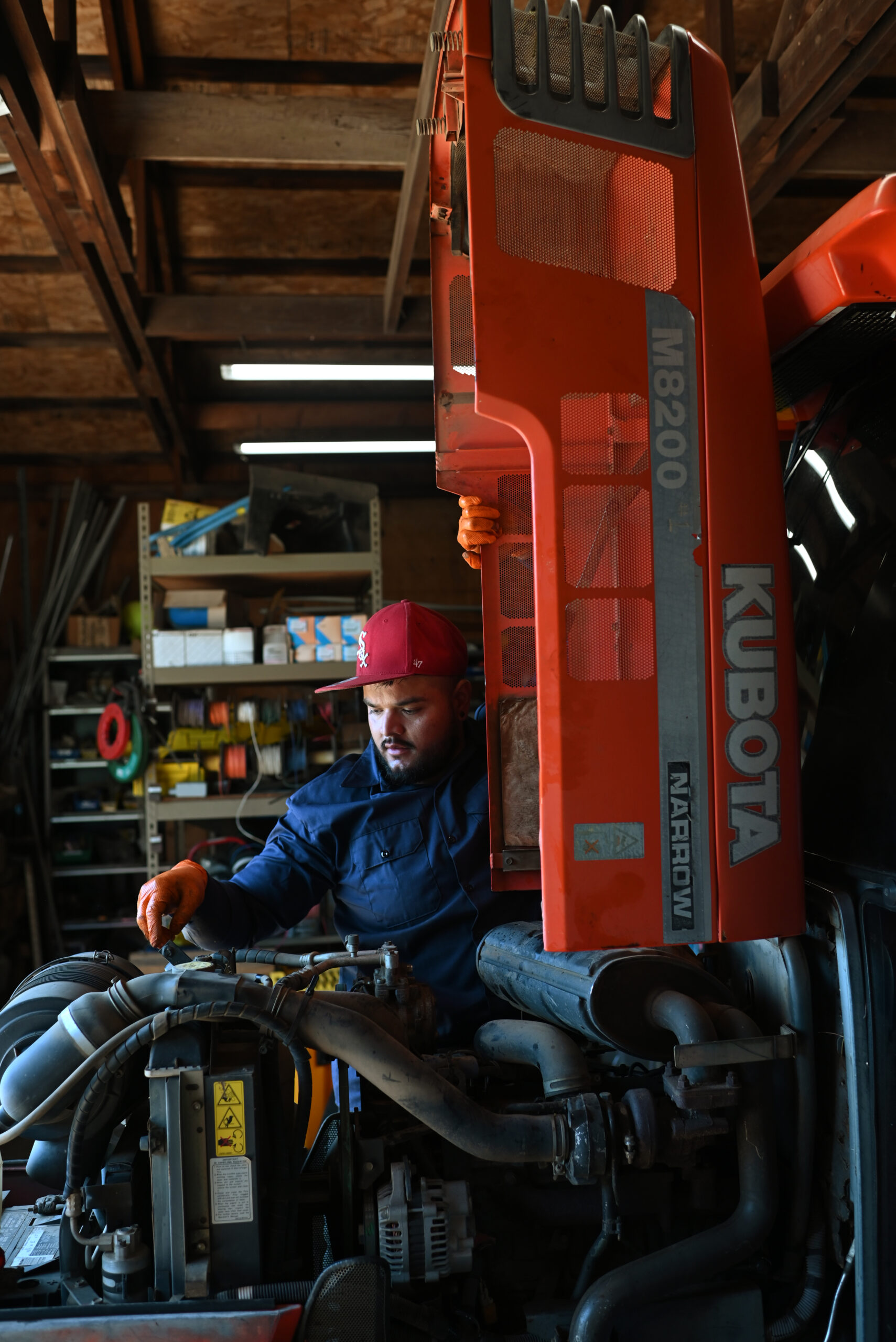 Alejandro Arellano, 28, working on getting one of winery’s Kubota tractors ready for harvest season at Bedrock Vineyard in Glen Ellen, Calif. on July 7, 2023. (Photo: Erik Castro/for Sonoma Magazine)