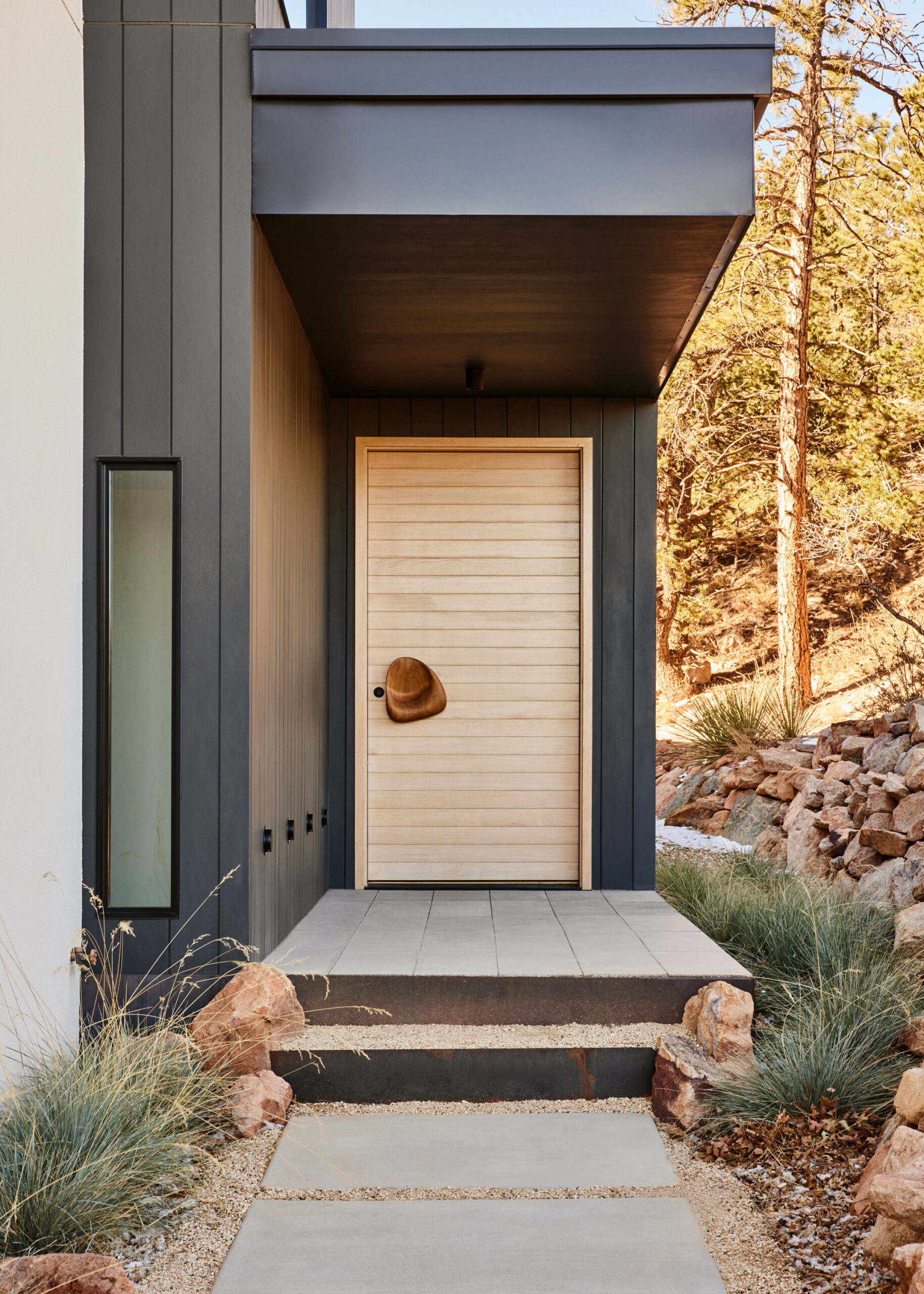 The home has exceptional design details like this organically shaped wood doorknob. (Nicole Franzen)