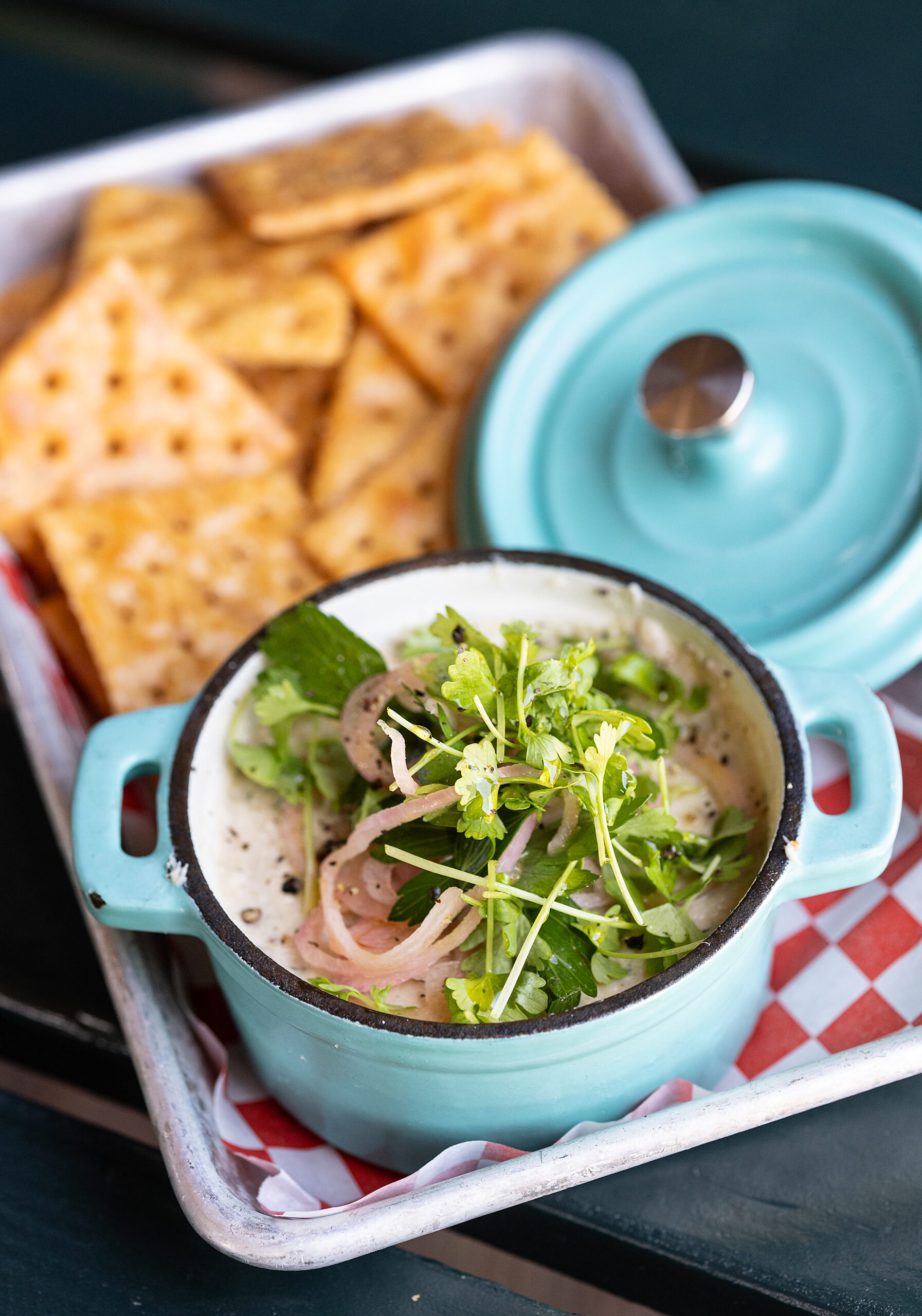 Smoked Black Cod Dip with celery, pickled shallots and fried saltines from Nick’s Cove Restaurant on Tomales Bay Monday, September 18, 2023. (Photo John Burgess/The Press Democrat)
