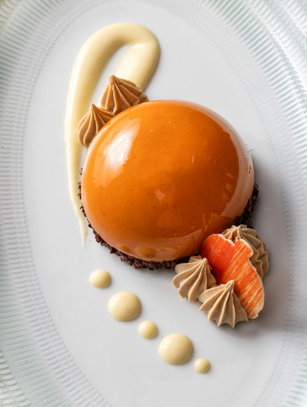 A Pumpkin Spice Mousse Bomb with vanilla bean, espresso Chantilly and ginger créme anglaise from the Dry Creek Kitchen Thursday, November 2, 2023 in Healdsburg. (Photo John Burgess/The Press Democrat)