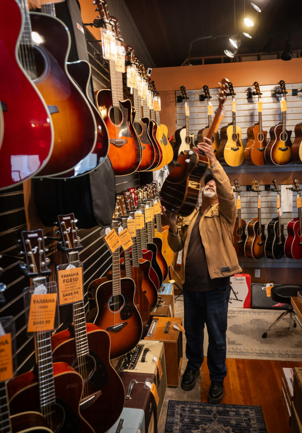 Owner Neville Hormuz has a wide selection of guitars at Loud and Clear Music in Cotati September 22, 2023. (Photo John Burgess/The Press Democrat)