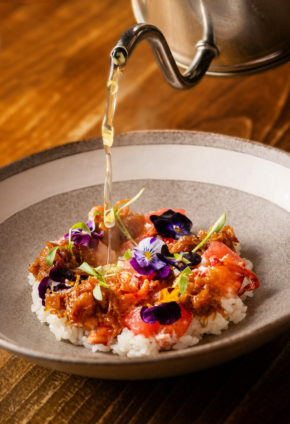 Lobster XO with a table side pour of shiitake lemongrass tea over sushi rice from the Golden Bear Station Thursday, January 11, 2023 on Hwy 12 in Kenwood. (Photo John Burgess/The Press Democrat)