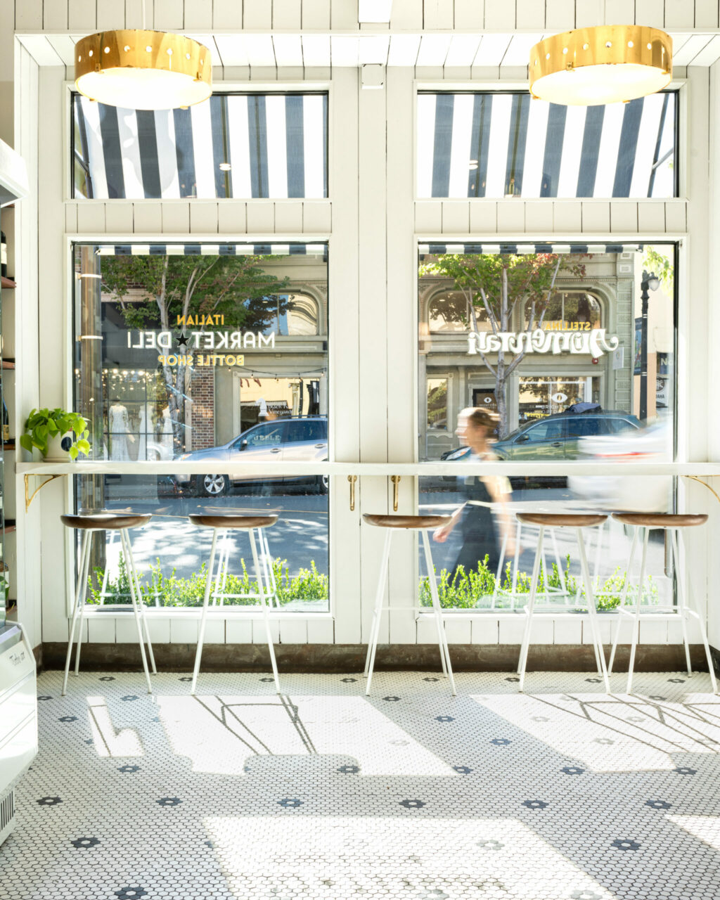 On the sunny side of the street: Counter stools at downtown Petaluma's Stellina Alimentari are prime for people watching. (Emma K Creative)