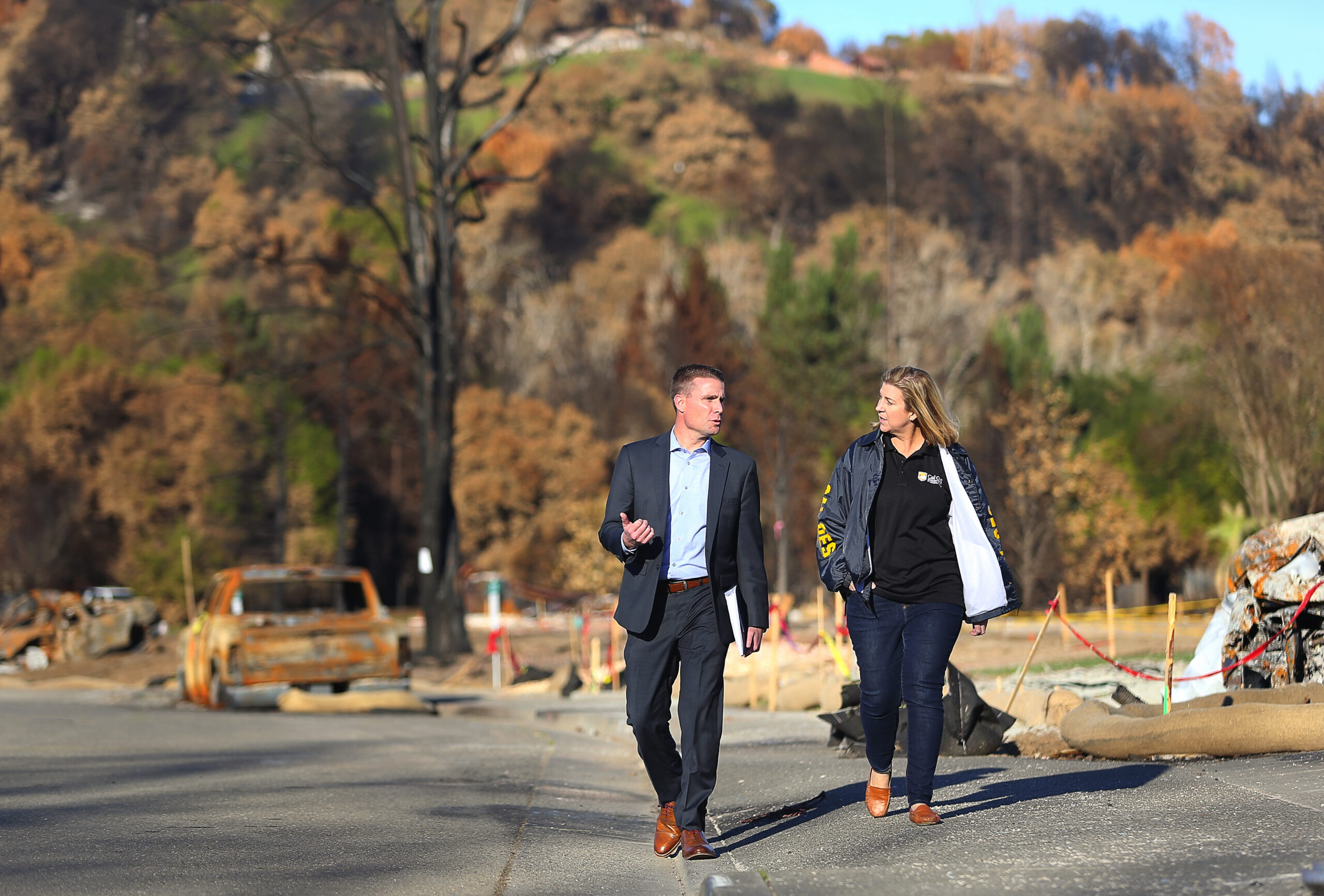 California Senator Mike McGuire and Jodi Traversaro, regional administrator for the California Office of Emergency Services, in the Larkfield-Wikiup area, are working together on the extensive rebuilding process following October's devastating wildfires. (Christopher Chung/ The Press Democrat)