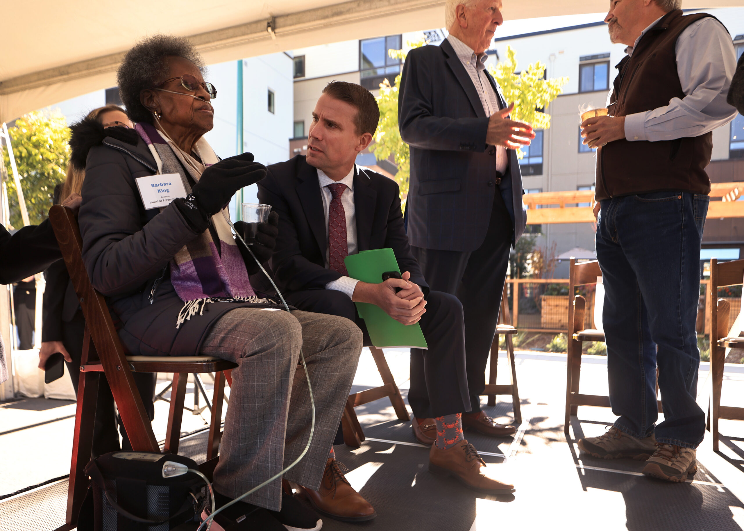 Mike McGuire, the California State Majority Leader, talks with Barbara King, Friday, Oct. 27, 2023, prior to a celebration of the completion of phase one of Burbank HousingÕs affordable housing project on land that housed the JourneyÕs End Mobile Home Park, razed in the 2017 Tubbs Fire. King lost her mobile home in the fire. (Kent Porter / The Press Democrat) 2023