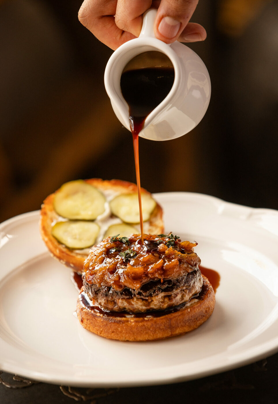 The Gallery Burger with fresh thyme, gruyère, caramelized onions with a table side pour of bordelaise sauce from Studio Barndiva Friday, February 23, 2024 in Healdsburg. (Photo by John Burgess/The Press Democrat)