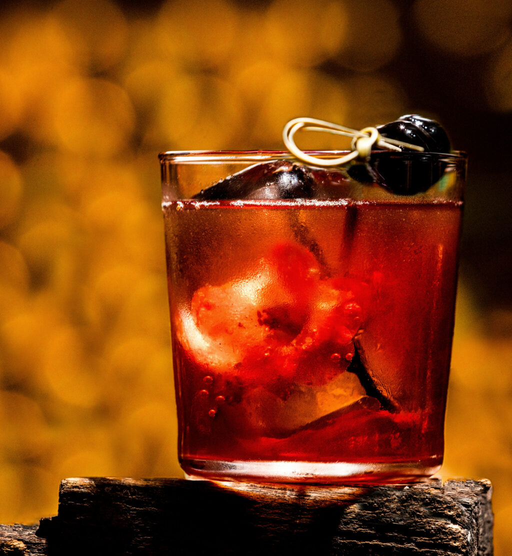 The Winter Manhattan with bourbon, rye, vermouth, asian pear, vanilla bean, bitters, Seville orange oil with a Quince blossom inside at Studio Barndiva Friday, February 23, 2024 in Healdsburg. (Photo by John Burgess/The Press Democrat)