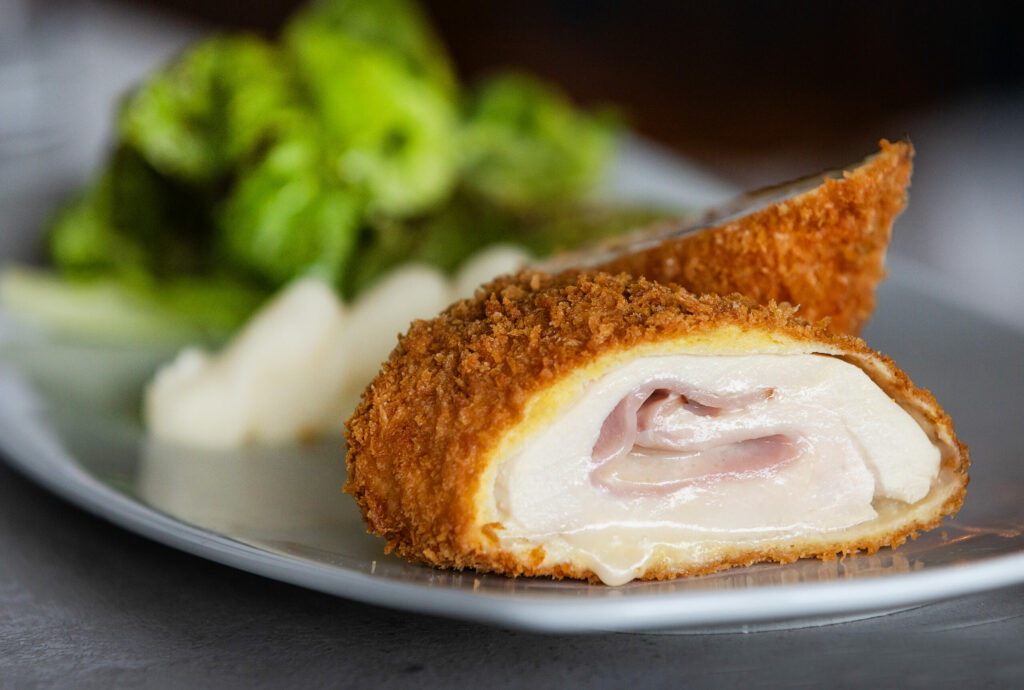 Chicken Cordon Bleu with potato purée and mixed green salad with Dijon vinaigrette from Tisza Bistro chef/owner Krisztian Karkus Monday, February 12, 2024 in Healdsburg. (Photo by John Burgess/The Press Democrat)