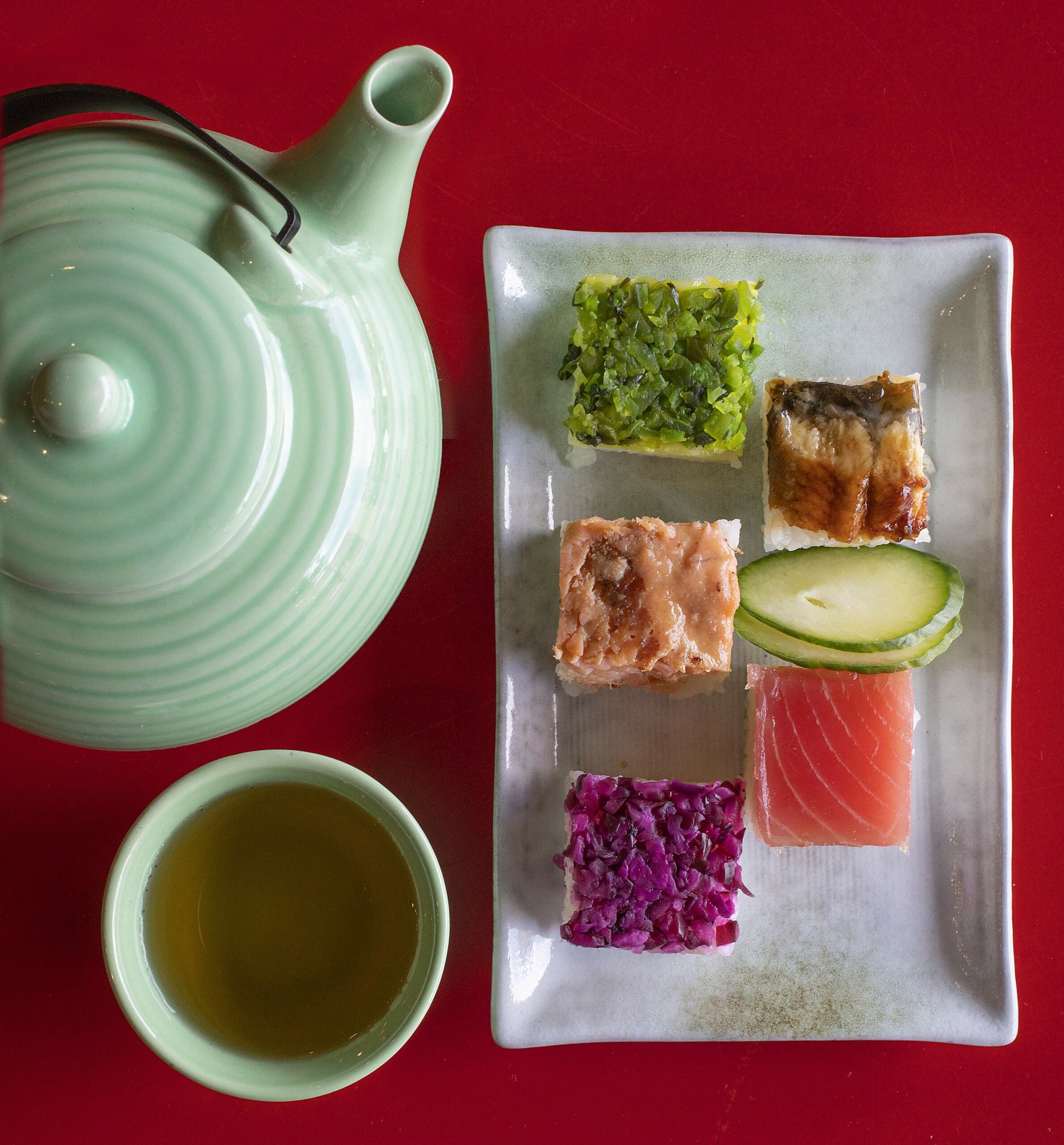 Clockwise from top left, pressed rice Oshizushi with pickled shiso, unagi, tuna, pickled shiso and miso cured salmon from Taste of Tea in Healdsburg. (John Burgess/The Press Democrat)
