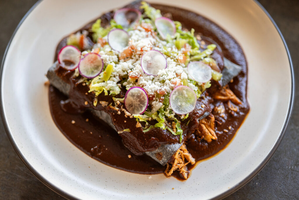 Jalisco-style Chicken Enchiladas with Mole from Quiote in downtown Petaluma, Friday, Sept. 8, 2023. (John Burgess / The Press Democrat)