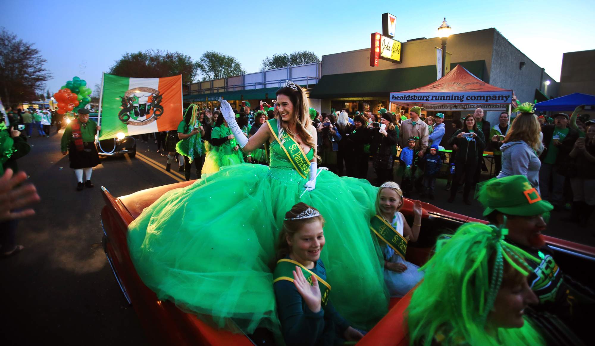 Meghan Tripp of Healdsbug, the Healdsburg St. Patrick's Day princess, with her court, Ireland Heyfron, 7, left and Katelyn Filben, 6, right, on Friday, March 17, 2017. (Kent Porter / The Press Democrat)