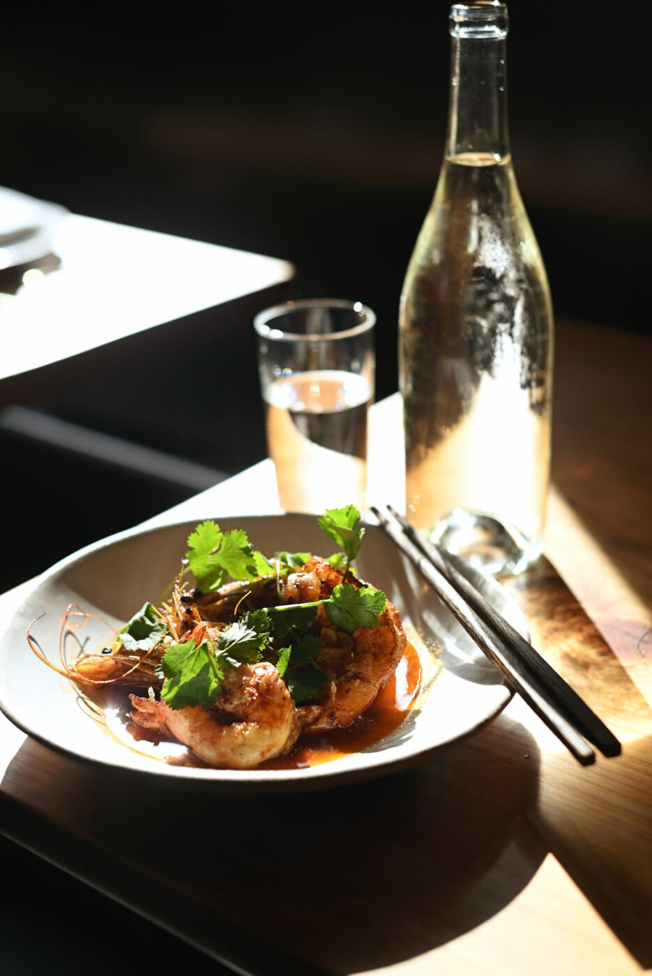 Wood fired wild head on prawns, silk road spices, shallots and olive oil at Slanted Door in Napa, Thursday, Feb. 22, 2024. (Erik Castro / For The Press Democrat)