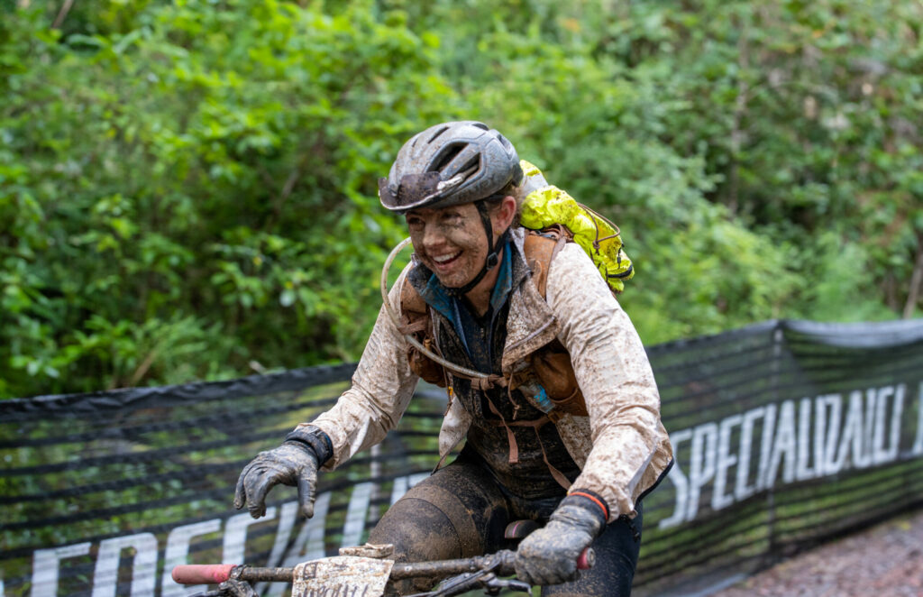 Top rider Larissa Connors of Santa Rosa finishes a muddy Mendocino Hopper in 2023. (Brian Tucker)