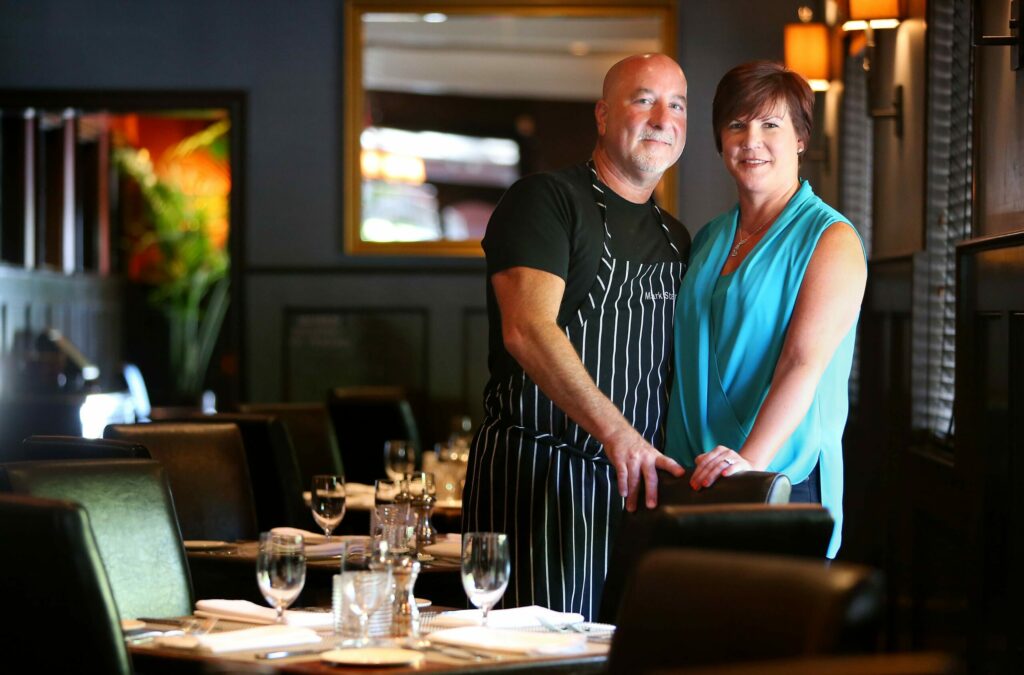 Mark and Terri Stark at Stark's Steak & Seafood, in Santa Rosa on Tuesday, July 8, 2014. The couple also owns Bravas Bar De Tapas, Willi's Wine Bar, Willi's Seafood & Raw Bar, and Monti's Rotisserie & Bar, and are getting ready to open a sixth restaurant in Sonoma County.(Christopher Chung/The Press Democrat)