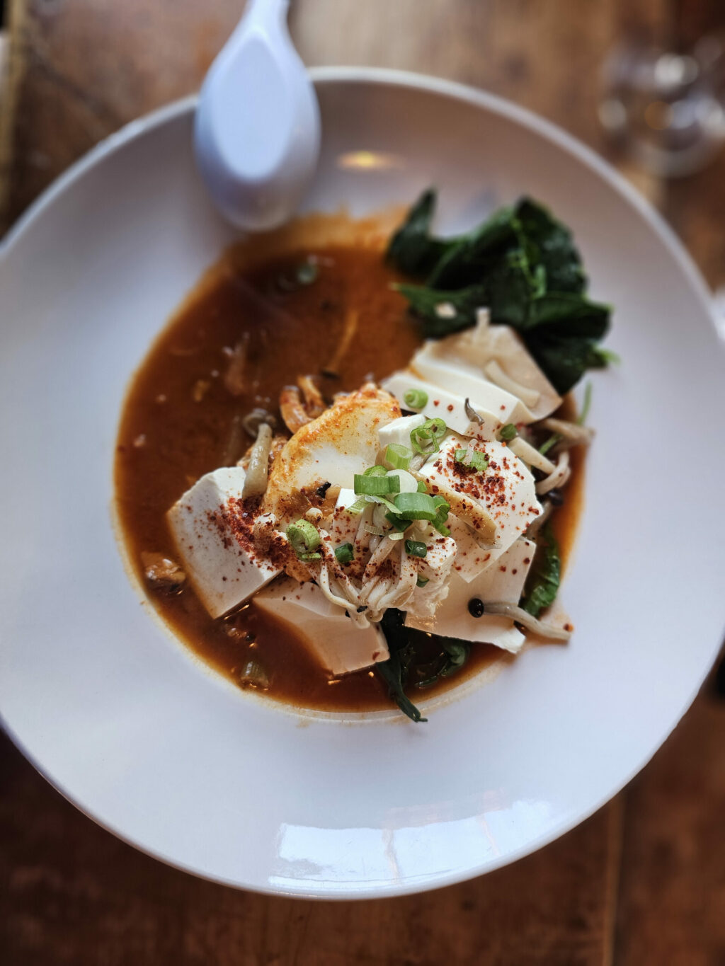 Kimchi and tofu stew with enoki mushrooms and a duck egg at The Casino's Half Hitch pop-up. (Heather Irwin)