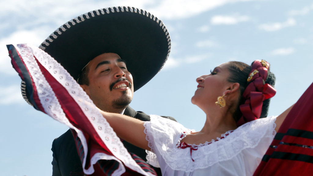 Joel Garcia and Angelica Ramirez of V!va Folklorico dance on stage during the Roseland Cinco de Mayo festival, in Santa Rosa, California, on Saturday, May 5, 2018. (Alvin Jornada / The Press Democrat)
