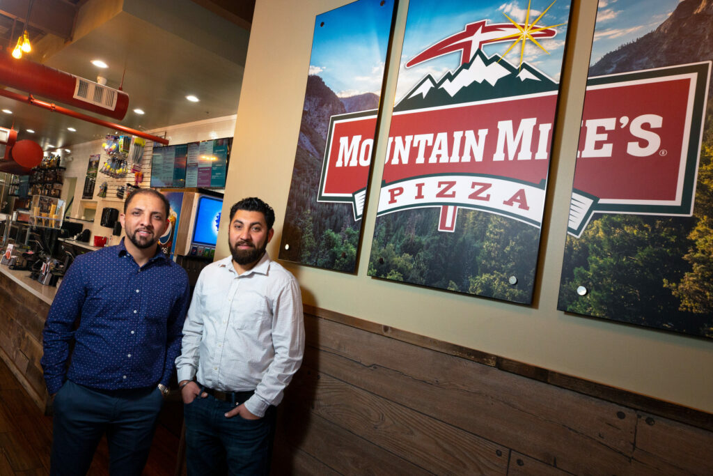 Chandi Hospitality Group founder/president Sonu Chandi, left, and senior vice president/COO Joti Chandi pose for a portrait at the rebuilt Mountain Mike's Pizza location on Cleveland Avenue in Santa Rosa, California, on Wednesday, November 20, 2019. (Alvin Jornada / The Press Democrat)