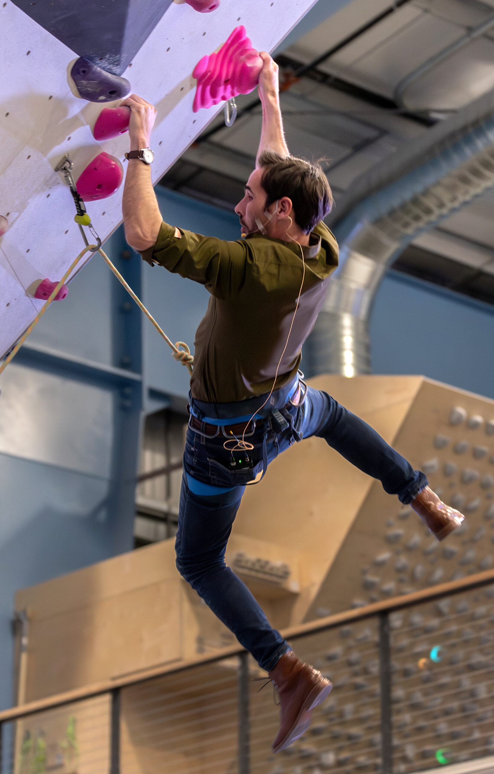 Kevin Jorgeson, co-founder and CEO of Session Climbing, gives a rock climbing demonstration for guests, on his way to the top of the wall during Climb 2 Recovery, a benefit for Women’s Recovery Services at Session Climbing’s gym, in Santa Rosa, Saturday, March 16, 2024.