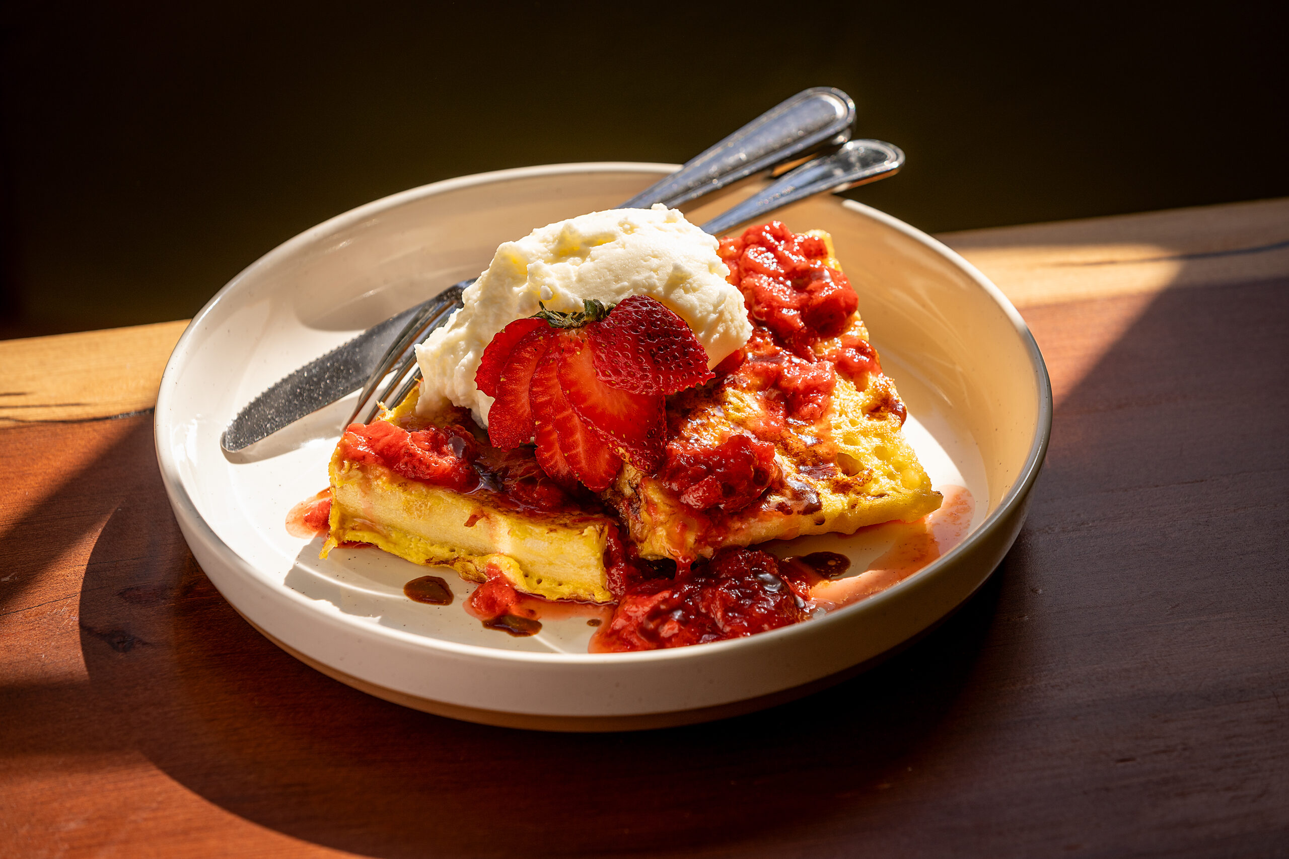 Strawberries & Cream French Toast with ciabatta bread, maple butter, strawberry lemon compote and sweet cream from Wild Poppy Cafe along the Bodega Highway west of Sebastopol Friday, May 3, 2024. (John Burgess/The Press Democrat)