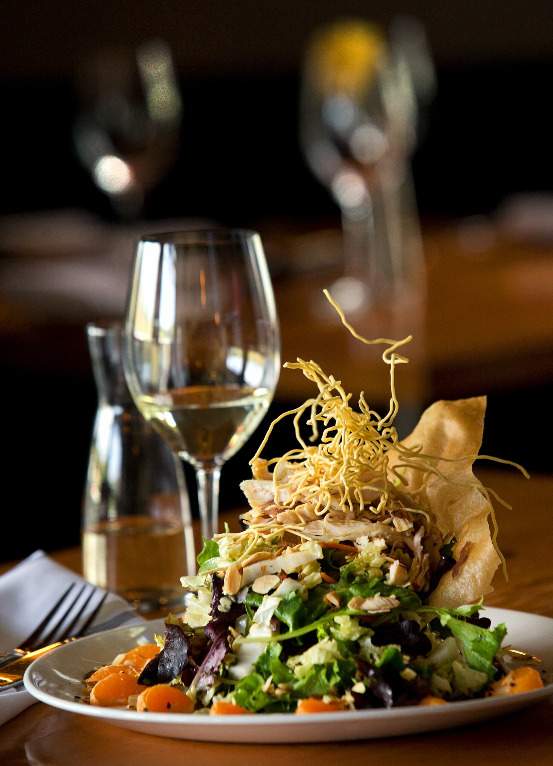 Shanghai Chicken salad with field greens, napa cabbage, carrot, cilantro, toasted almonds, mandarins, crispy noodles and a kaffir lime vinaigrette from the Salt & Stone in Kenwood. (John Burgess/The Press Democrat)