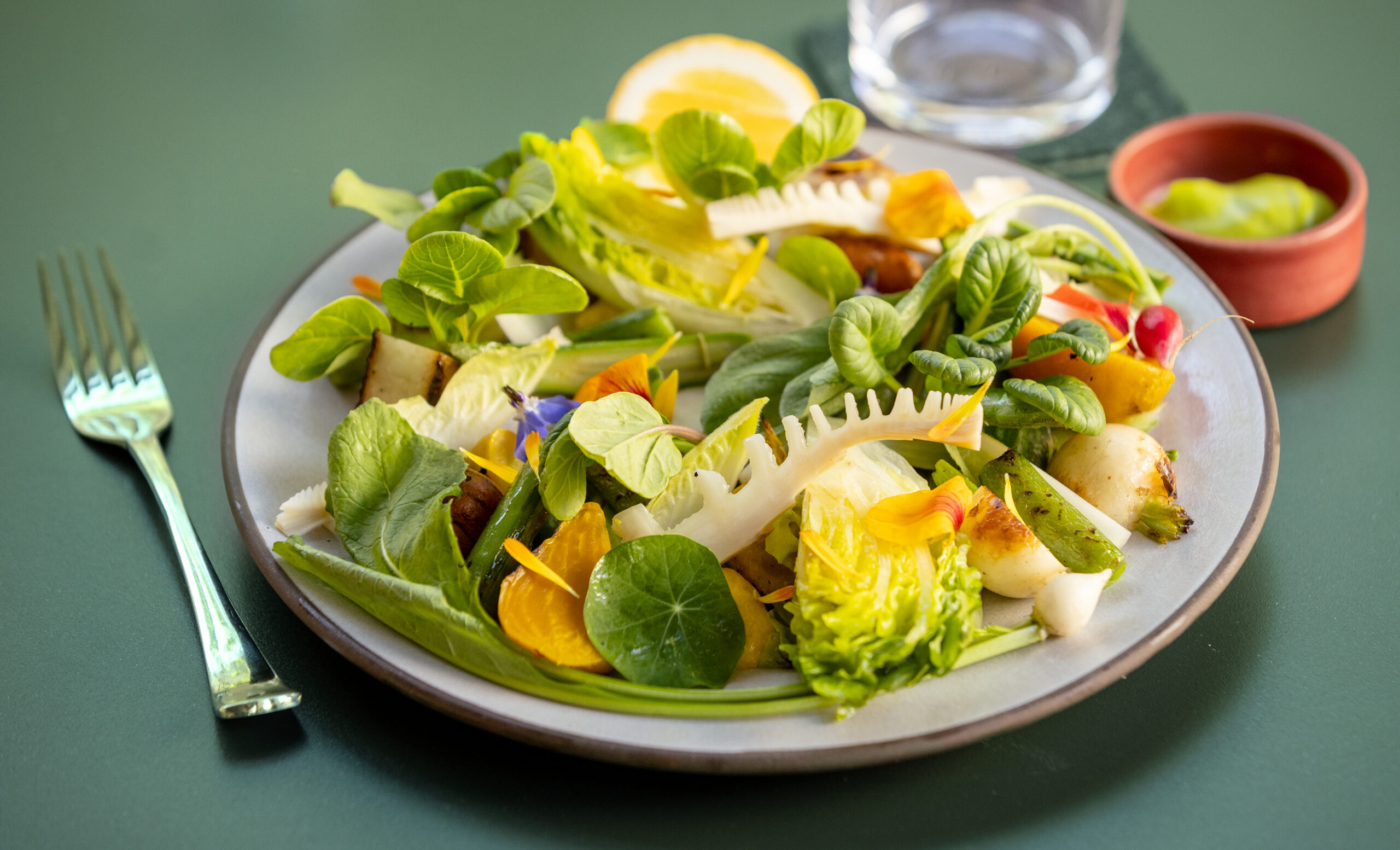 Plate of early summer vegetables from Bistro Lagniappe Thursday, June 19, 2025, in Healdsburg. (John Burgess / The Press Democrat)