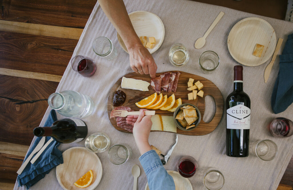 Guests customize their Cline Family Cellars cabana retreat, with bottle service and an array of nibbles like cheese and charcuterie plates, or a Wine Country Basket packed with goodies like Brie, Manchego cheese, salami, Italian cheese crackers, cookies and fig jam. (Cline Family Cellars)