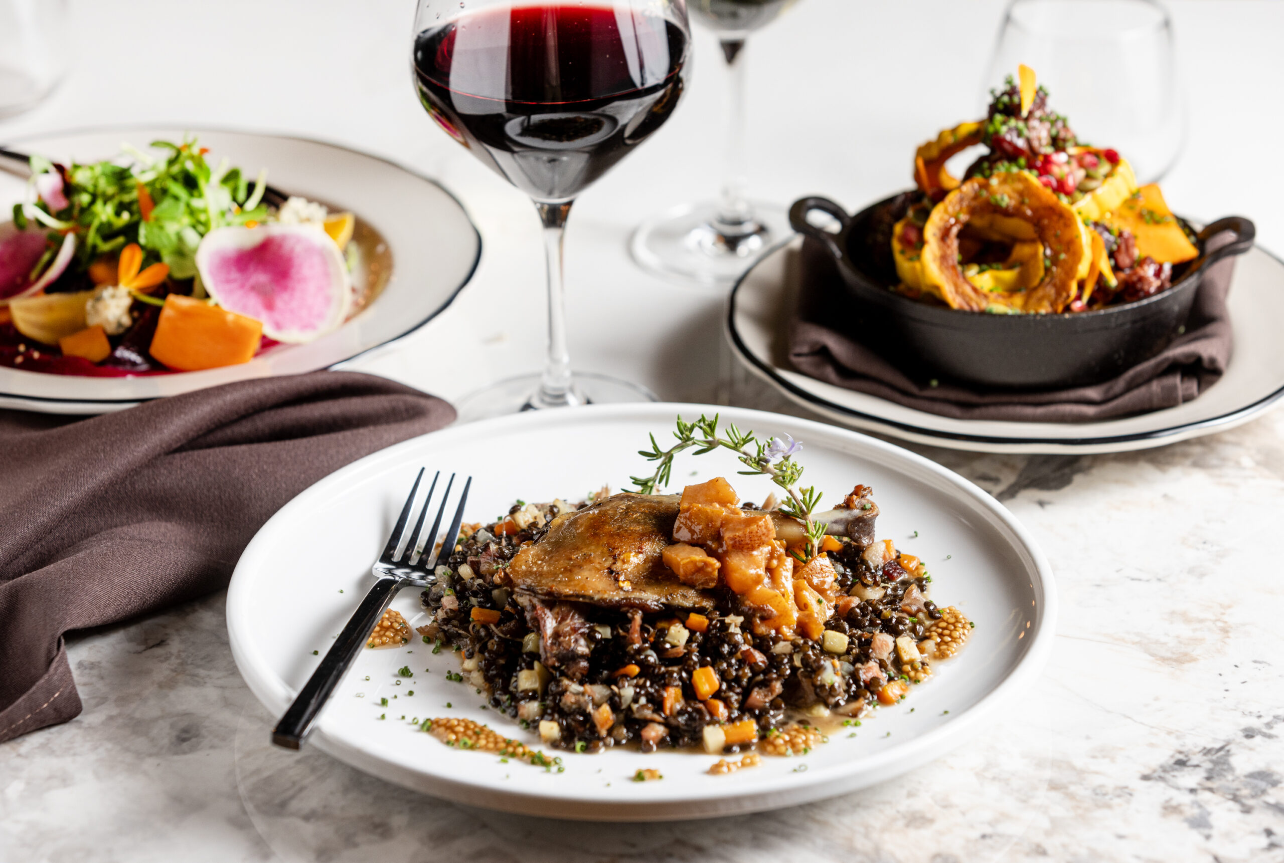 Duck confit, Journeyman guanciale, beluga lentil cassoulet, d'anjou pear mostarda from Songbird Parlour Thursday, November 21, 2024, in Glen Ellen. (John Burgess / The Press Democrat)