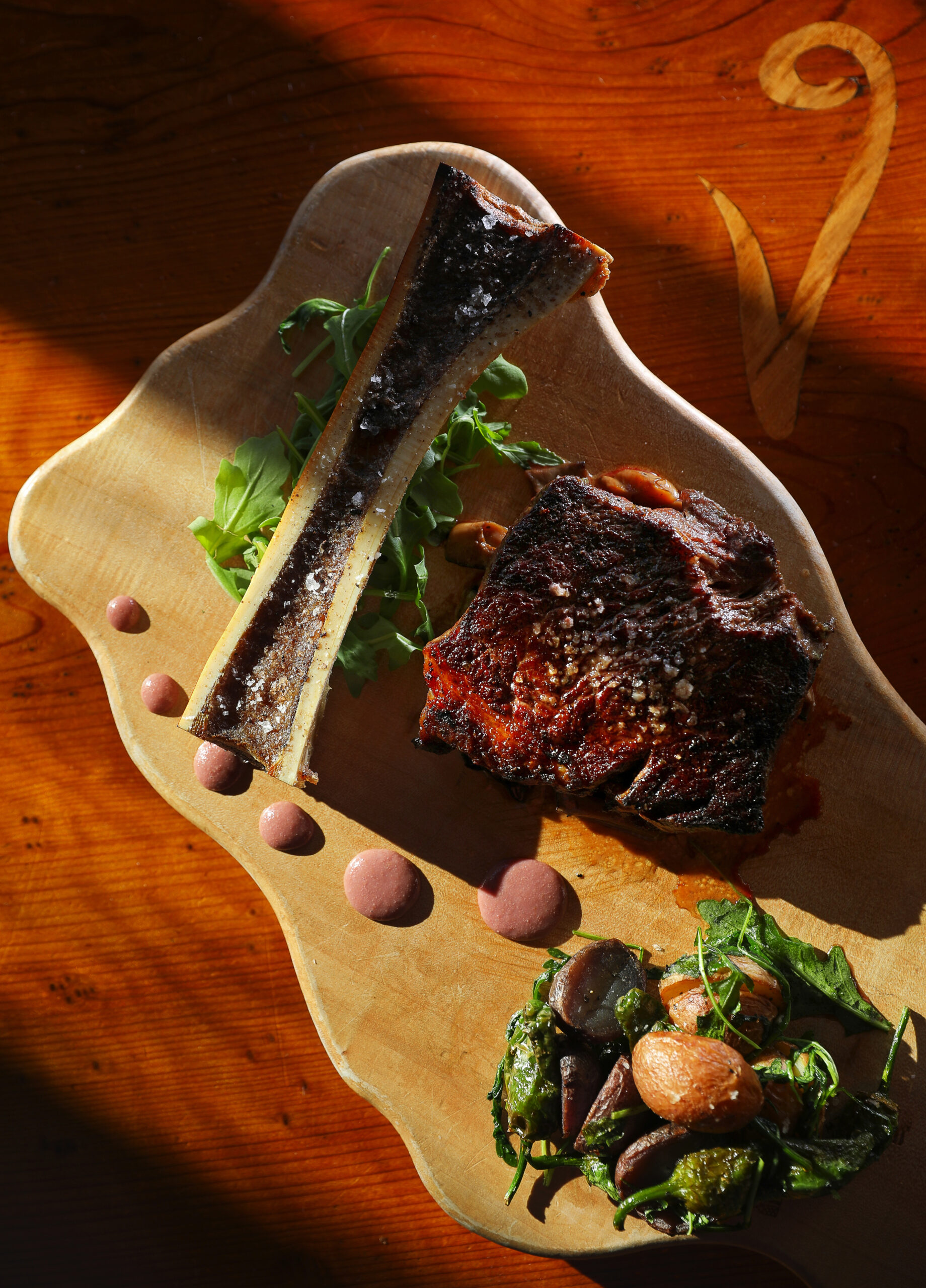 Peppercorn crusted New York steak with wild mushroom fondue, and roasted bone marrow, served with potato and pepper hash, by chef Dustin Valette at Valette, in Healdsburg. (Christopher Chung/ The Press Democrat)