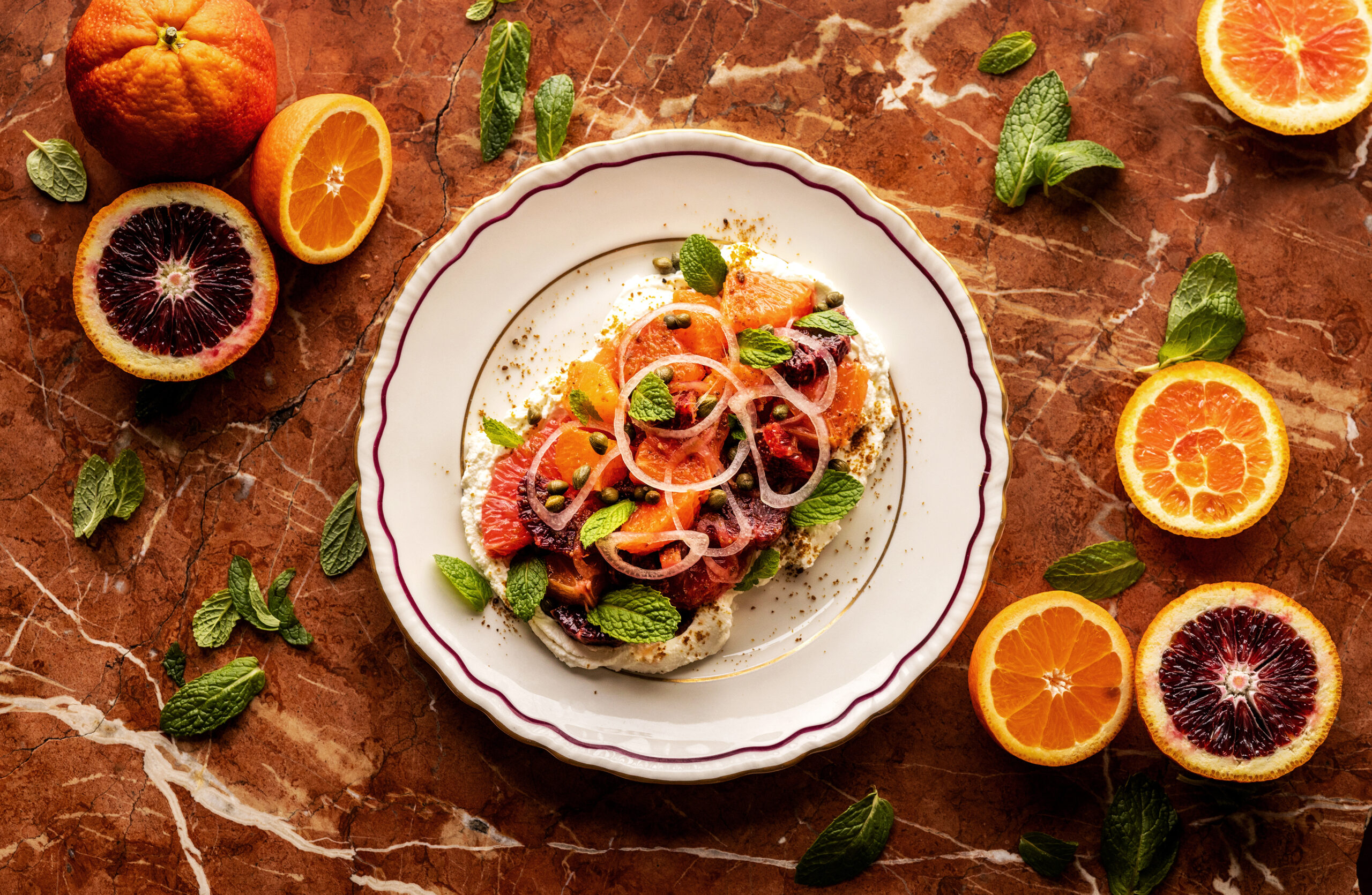Winter Citrus Salad with Blood orange, cara cara, grapefruit, tangelo labneh, vadouvan, shallot, capers and mint from The Redwood chef/owner Geneva Melby Thursday, February 27, 2025, in Sebastopol. (John Burgess / The Press Democrat)