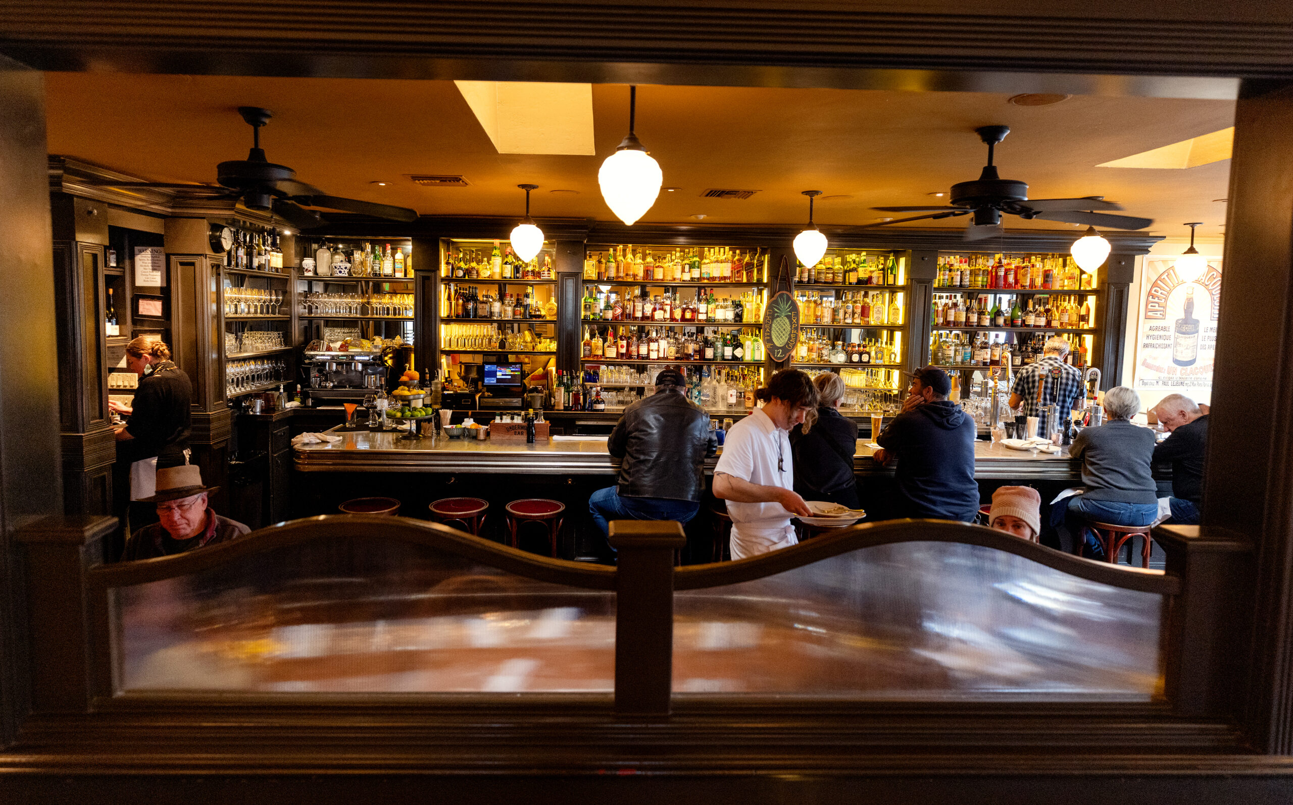 The view into the bar from the main dining room at Underwood Bar and Bistro Friday, March 21, 2025, in Graton. (John Burgess / The Press Democrat)