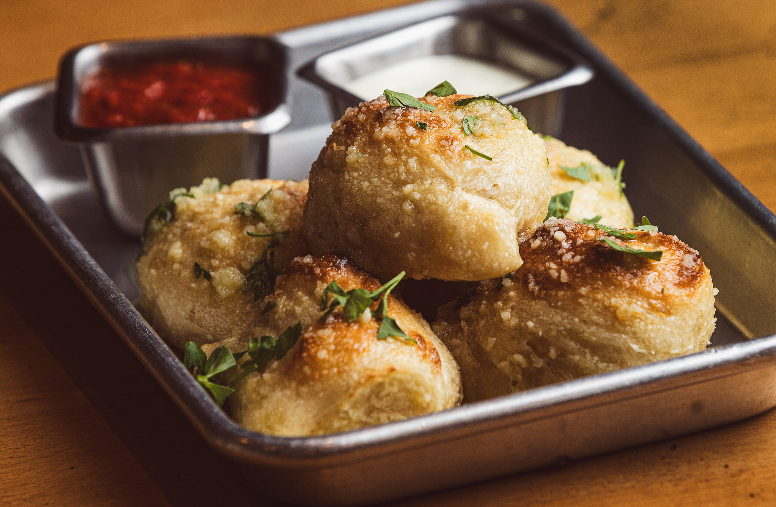 Garlic Knots with garlic oil, Parmesan and Italian parsley from PizzaLeah Wednesday, April 16, 2025, in Windsor. (John Burgess / The Press Democrat)