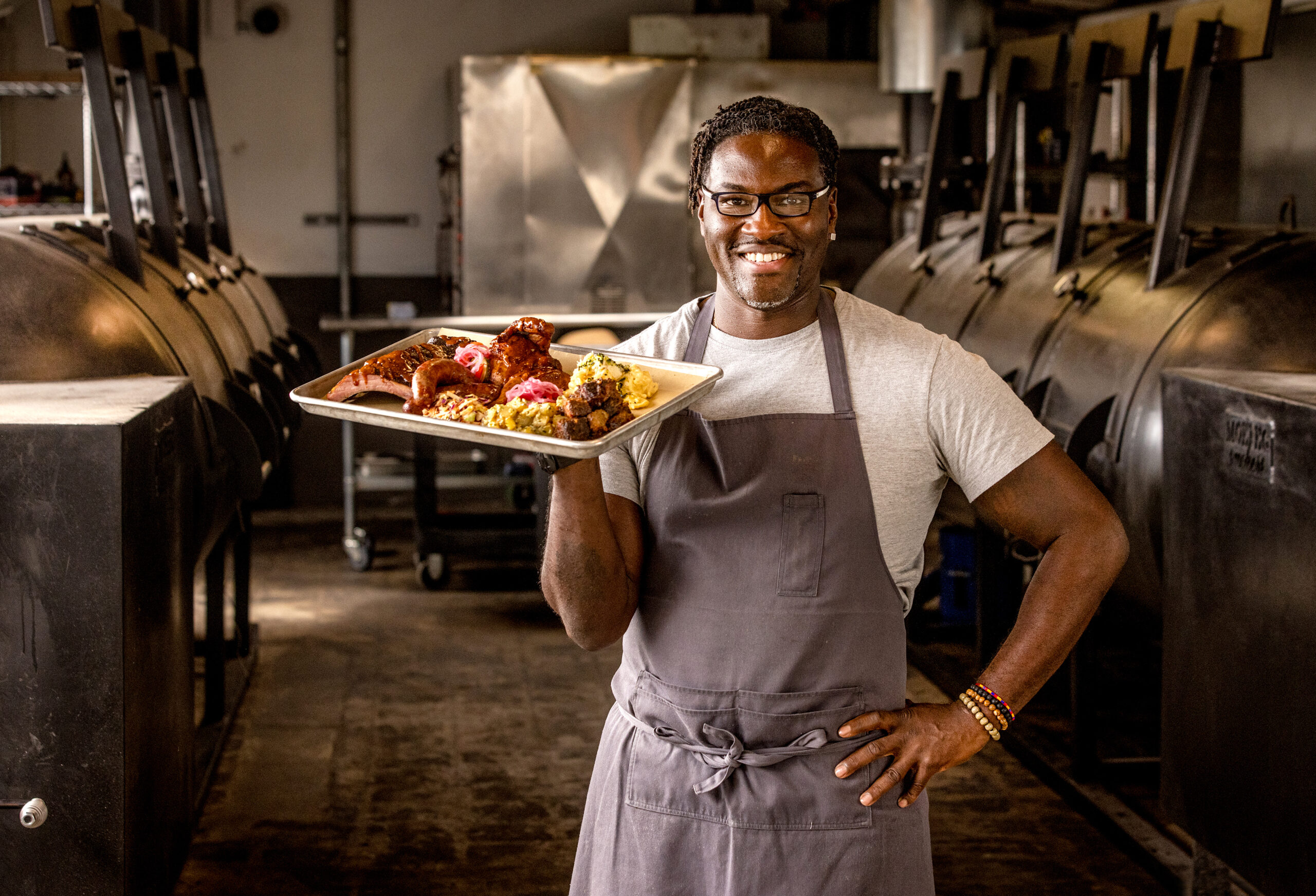 Chef Darryl Bell runs a fleet of smokers at the Stateline Road Smokehouse Friday, August 23, 2024, in Napa. (John Burgess / The Press Democrat)