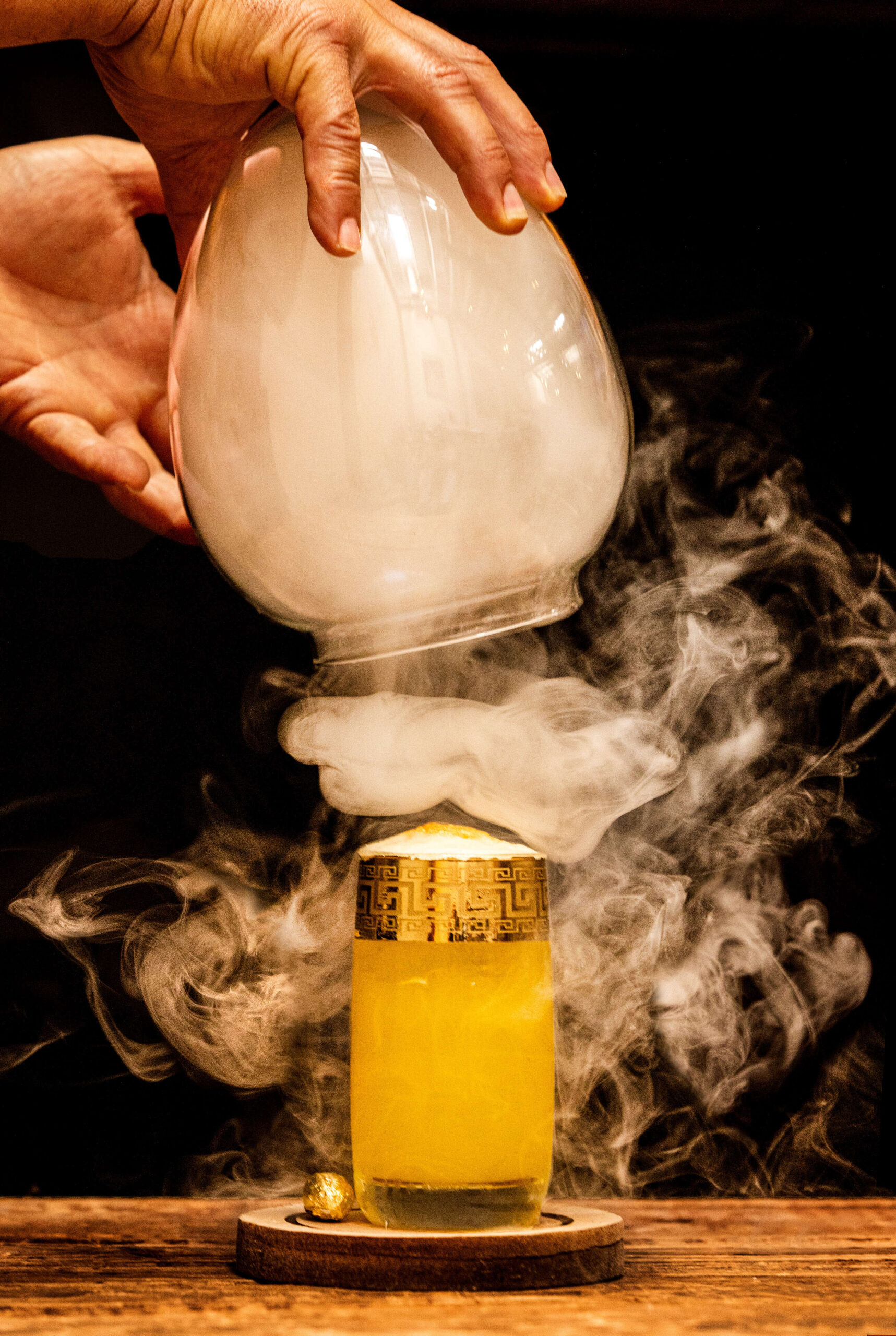 The Gallina D’Oro signature drink with Mezcal joven, pineapple saffron syrup, homemade pineapple foam with a dramatic, smoke reveal Friday, June 14, 2024 in Healdsburg. (John Burgess/The Press Democrat)