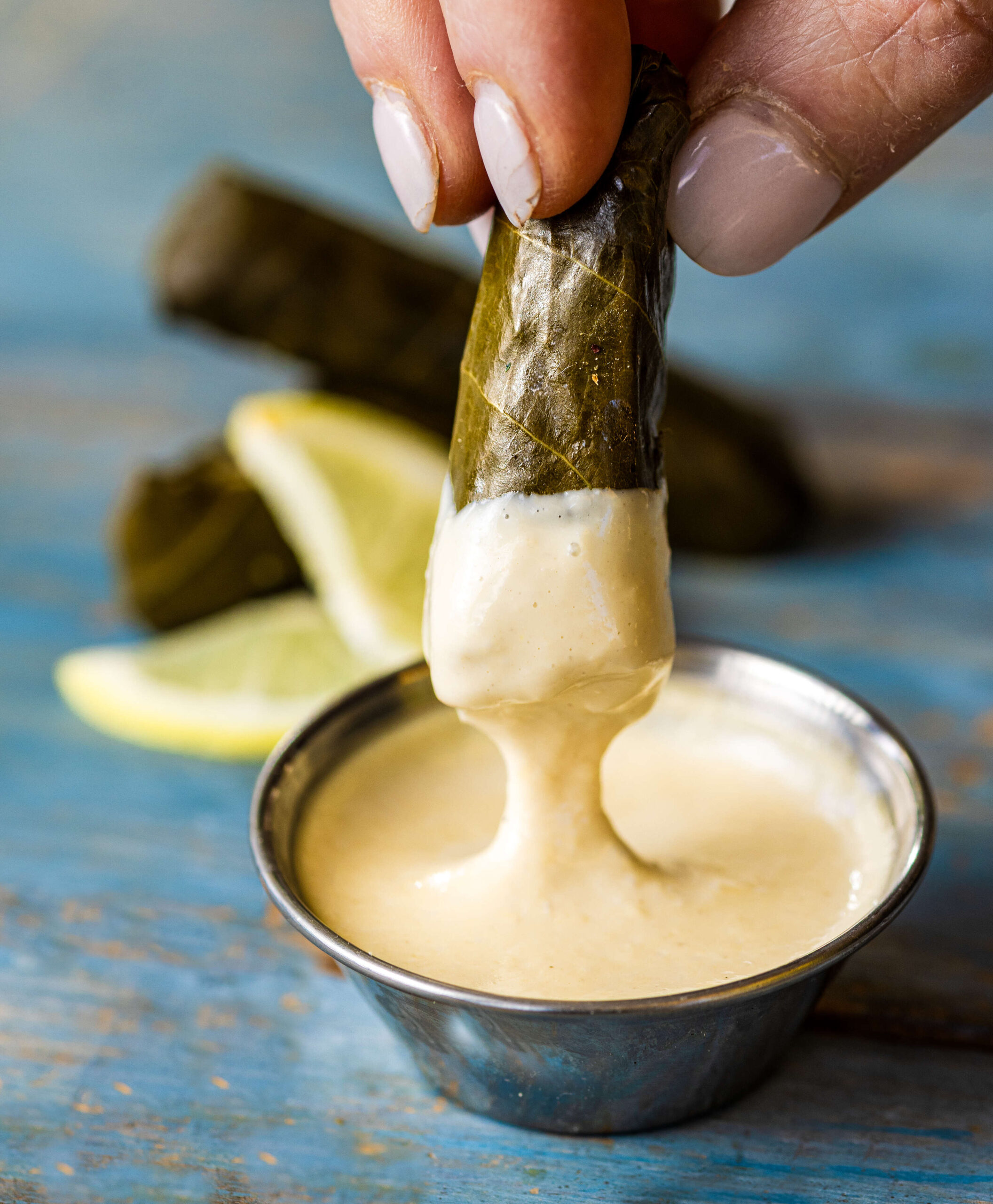 Spread Kitchen chef-owner Cristina Topham’s lemon-tahini sauce makes a great dip for stuffed grape leaves and veggies on the mezze plate Thursday, April 3, 2025 in Sonoma. (John Burgess / The Press Democrat)