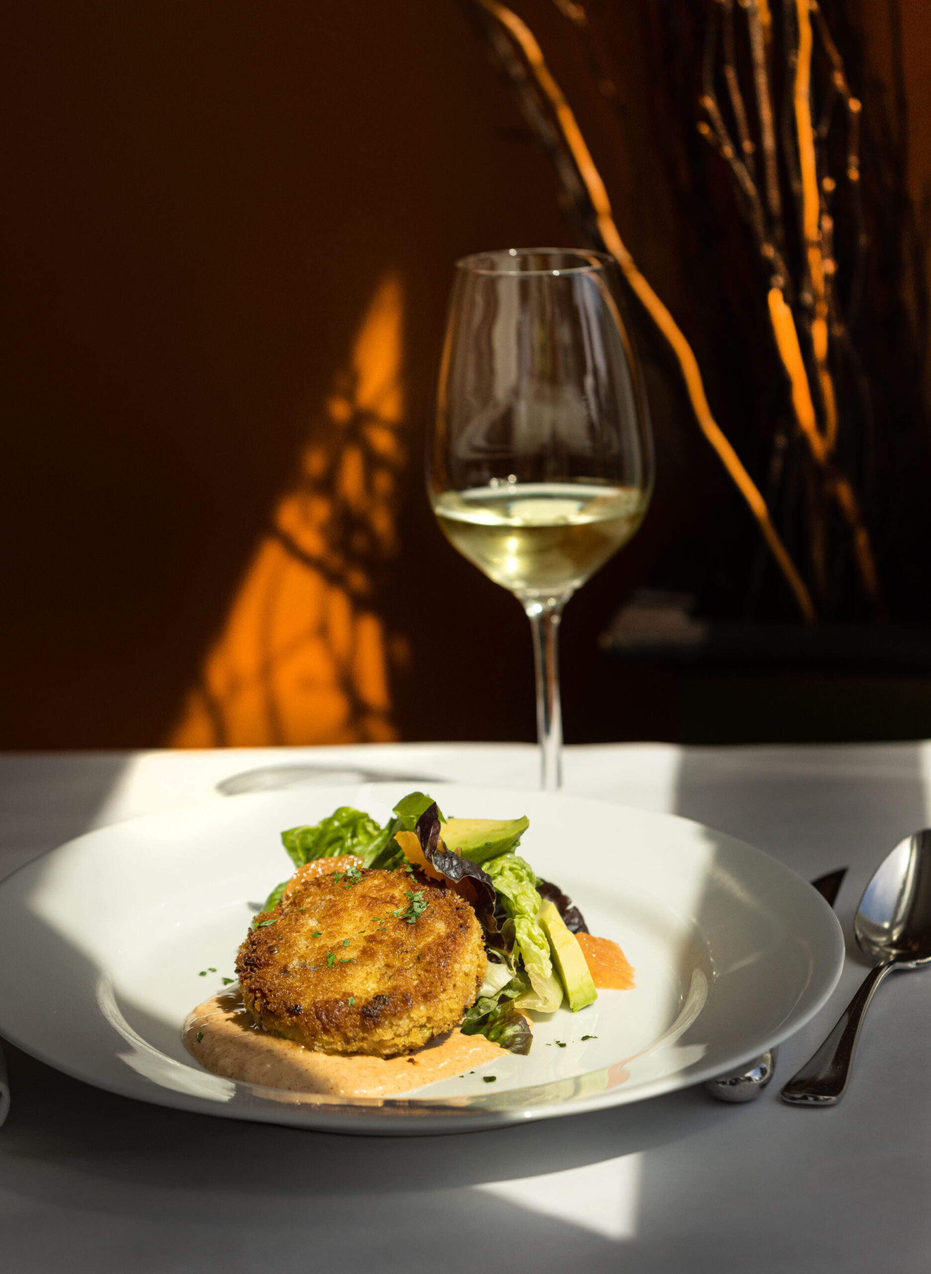 Dungeness Crab Cake with orange segments, avocado, mixed lettuces and remoulade sauce from Terrapin Creek Cafe Restaurant Friday, May 30, 2025, in Bodega Bay. (John Burgess / The Press Democrat)
