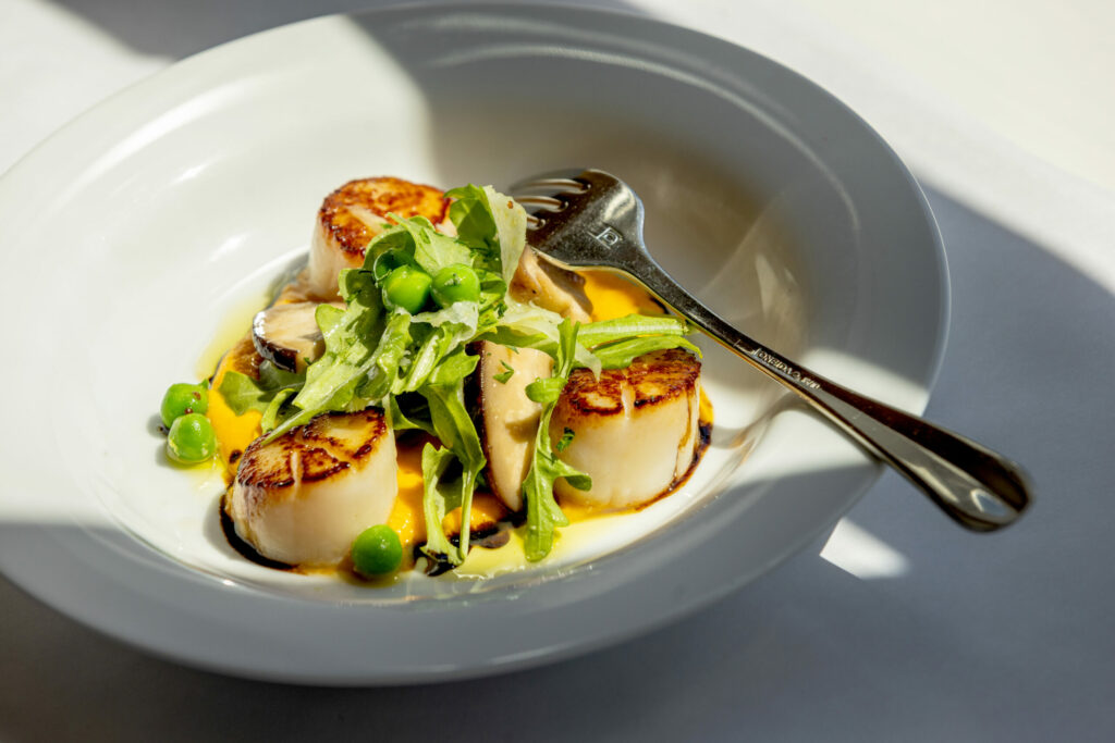 Pan Roasted Hokkaido Scallops with sunchoke purée, pickled shiitake mushroom, fennel, radish and arugula from Terrapin Creek Cafe Restaurant Friday, May 30, 2025, in Bodega Bay. (John Burgess / The Press Democrat)
