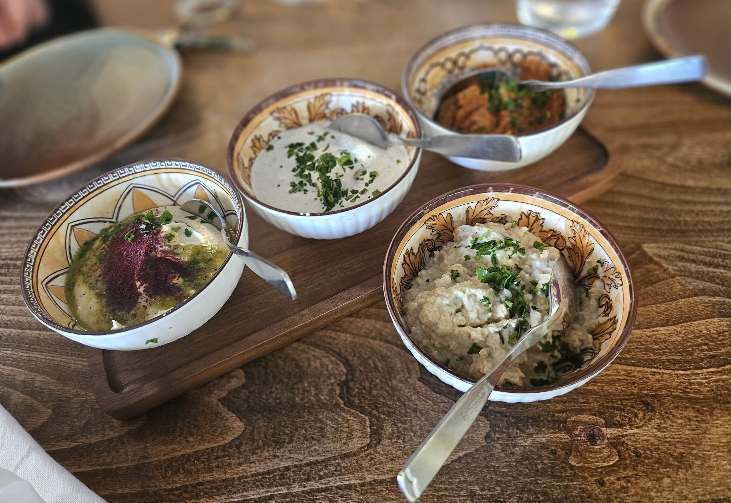 Cold mezze dips of hummus, baba ganoush, labneh and muhammara at Levant restaurant in Petaluma. (Heather Irwin/The Press Democrat)