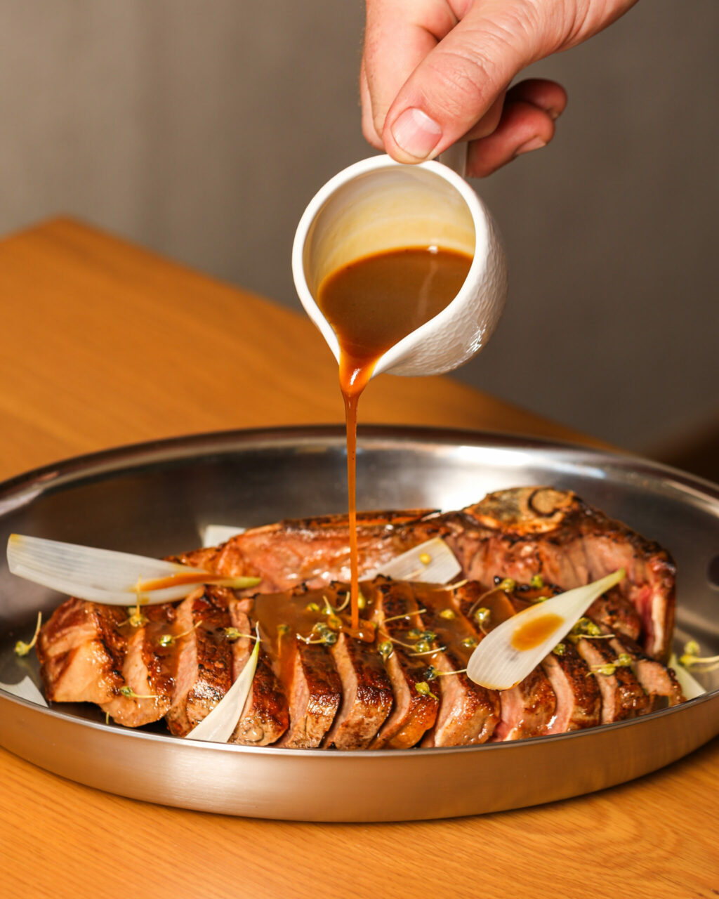 New York strip steak with jus from Appellation Healdsburg’s signature restaurant, Folia Bar & Kitchen. (Emma K Creative)