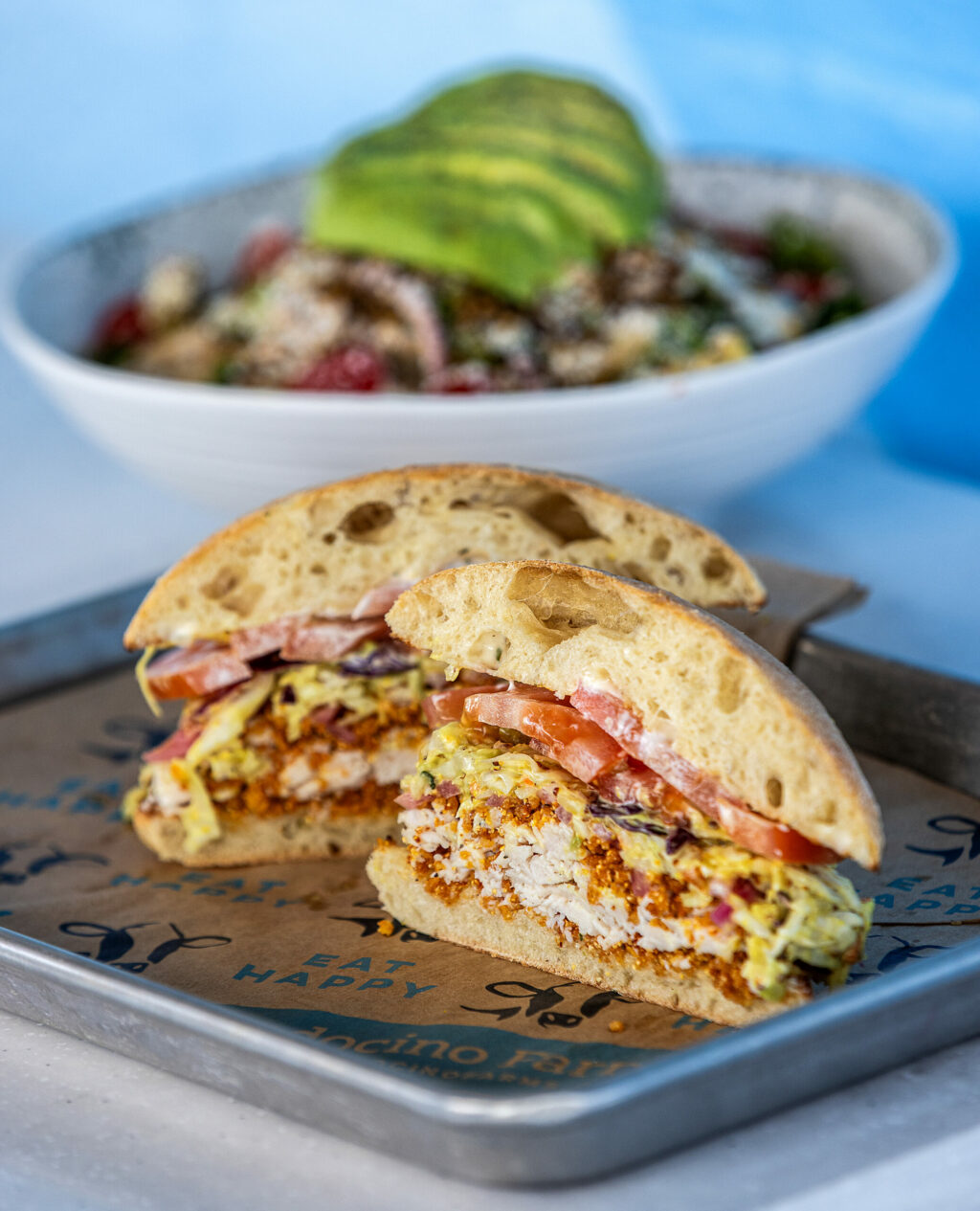 The “Not So Fried Chicken” Sandwich with Mendo’s krispies, herb aioli, mustard pickle slaw, tomatoes and pickled red onions on toasted ciabatta from Mendocino Farms Tuesday, May 13, 2025 in Santa Rosa’s Montgomery Village. (John Burgess / The Press Democrat)