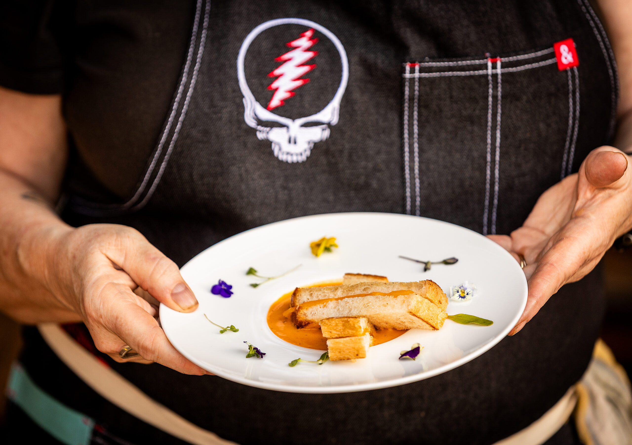 Private chef Jessie Keilt is the daughter of Grateful Dead lyricist Robert Hunter. After spending the previous day on stage introducing Dead & Company, Keilt created a meal for Trixie Garcia, daughter of Jerry, and Reya Hart, daughter of Mickey, at the family home of longtime friend and Sonoma County winemaker Phil Coturri Tuesday, August 5, 2025 in Sonoma. (John Burgess / The Press Democrat)